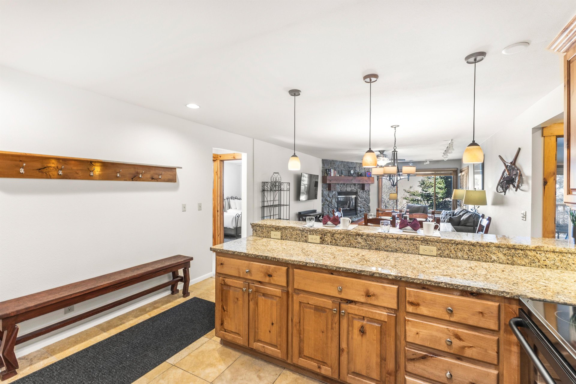 Snow Flower Condominium 14s granite counters with wood cabinets, as well as several power outlets for convenience.