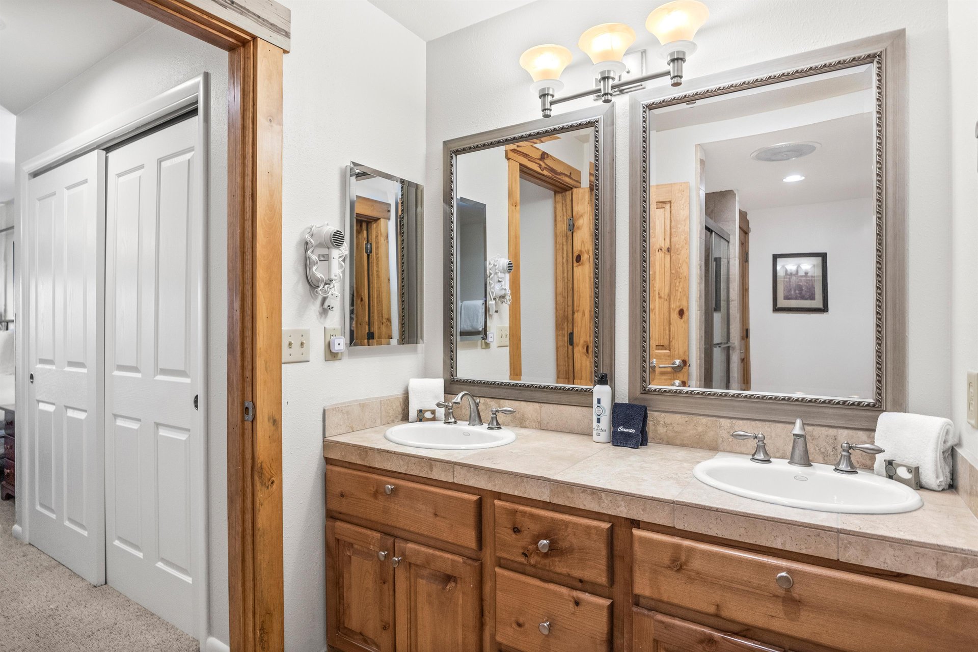 Snow Flower Condominium 14s main suite bathroom dual vanity with sinks.