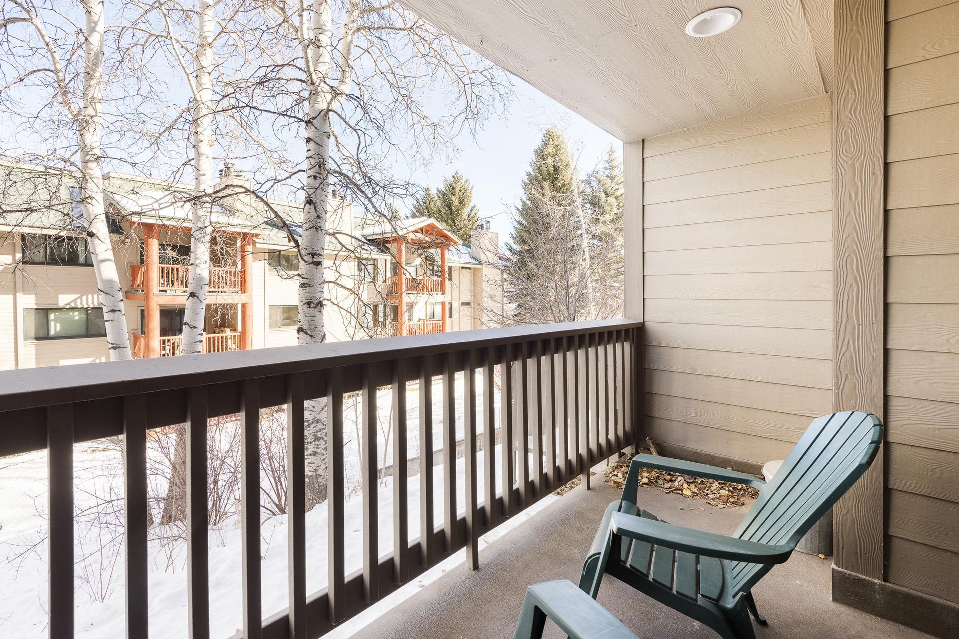 Premier Snow Flower Condominium 107s outside private patio.