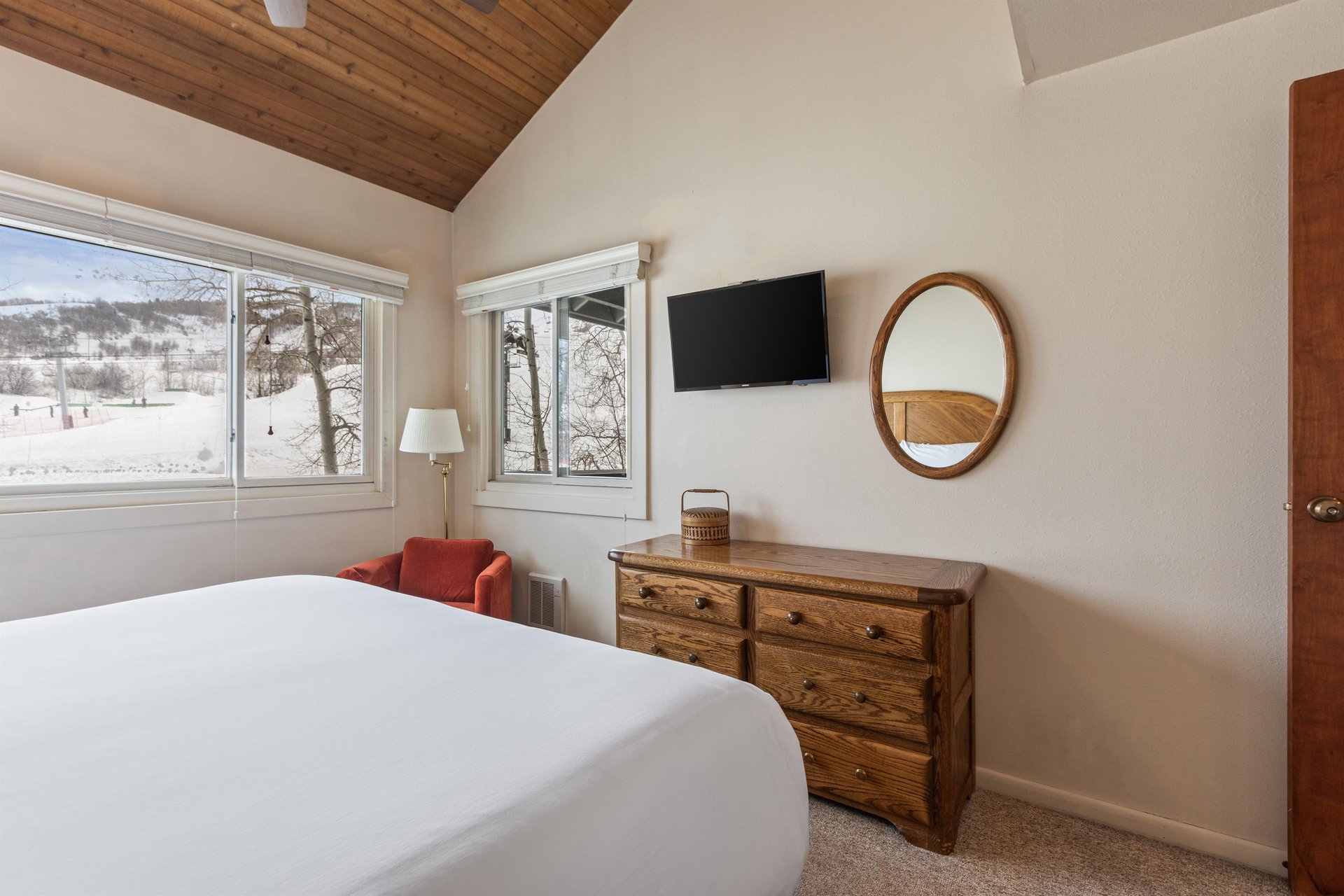 Premier Snow Flower Condominium 130s main suite flat screen TV and dresser.