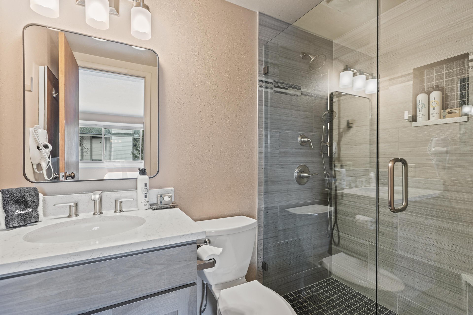 Premier Snow Flower Condominium 107s en suite bathroom with a walkin shower.