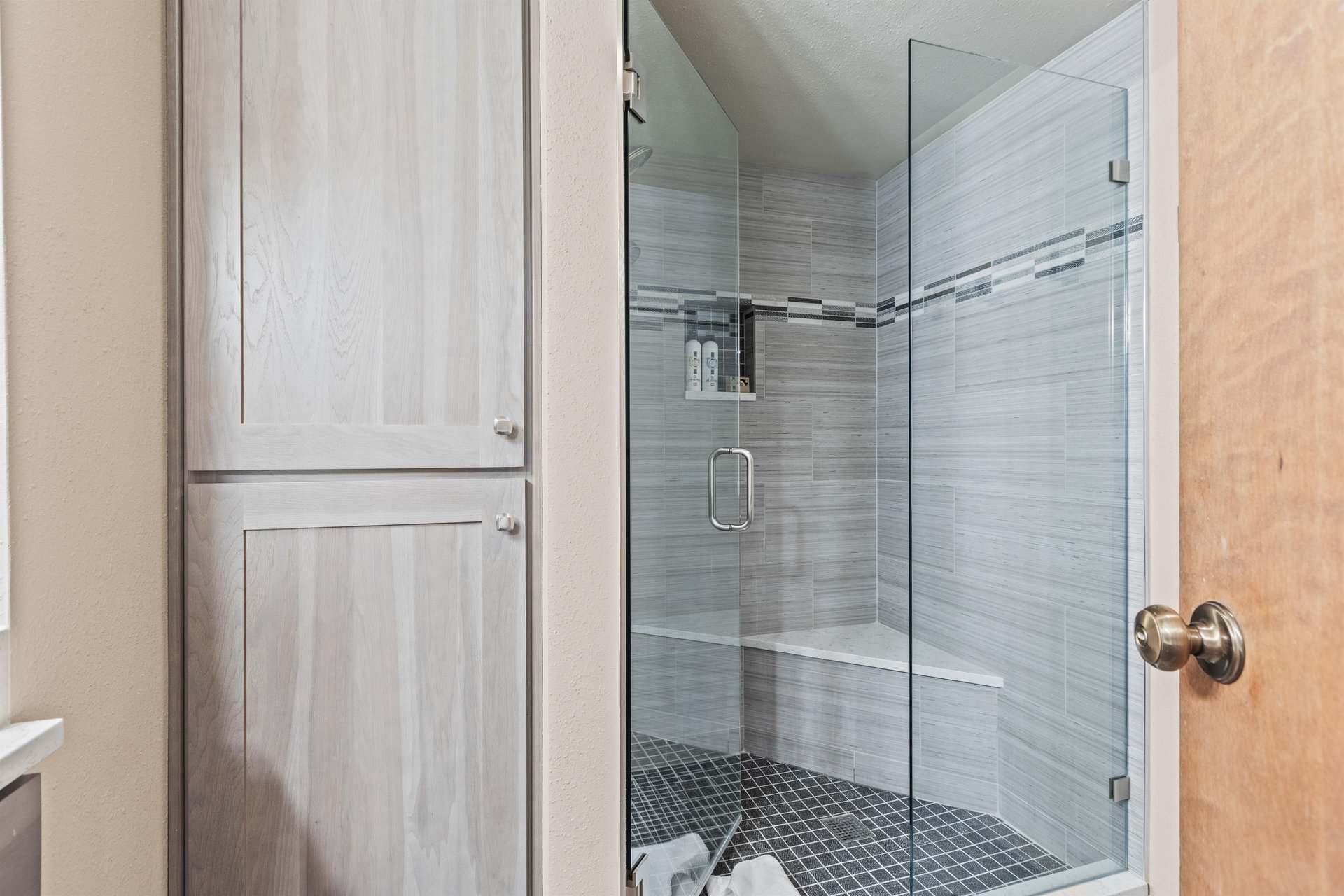 Premier Snow Flower Condominium 107s shared bathroom with walkin shower.
