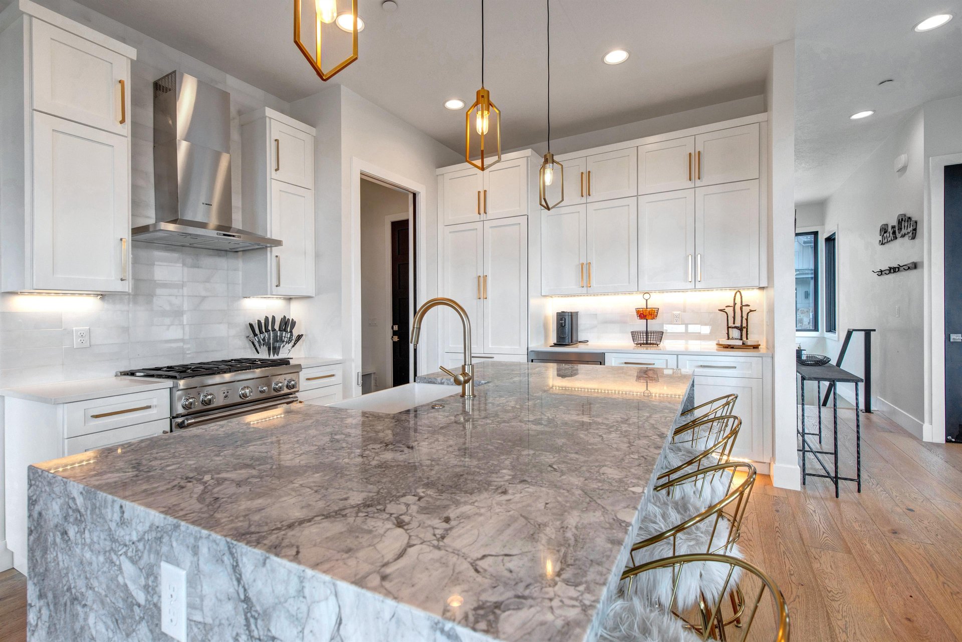 Easily prepare meals in this stunning gourmet kitchen featuring marble countertops and premium appliances.