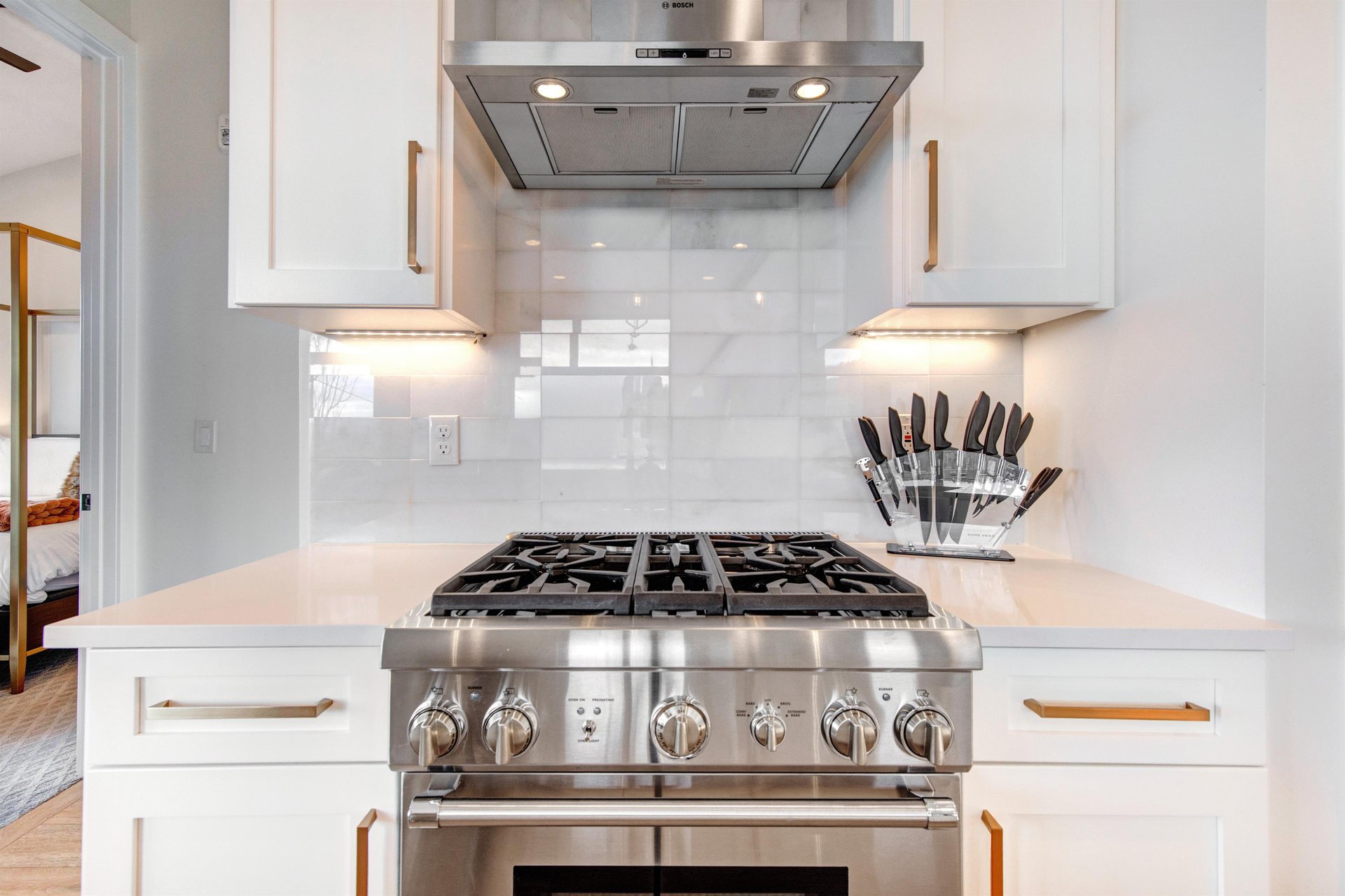 Your fullyequipped kitchen with professionalgrade gas range, sleek hood, and knife set.