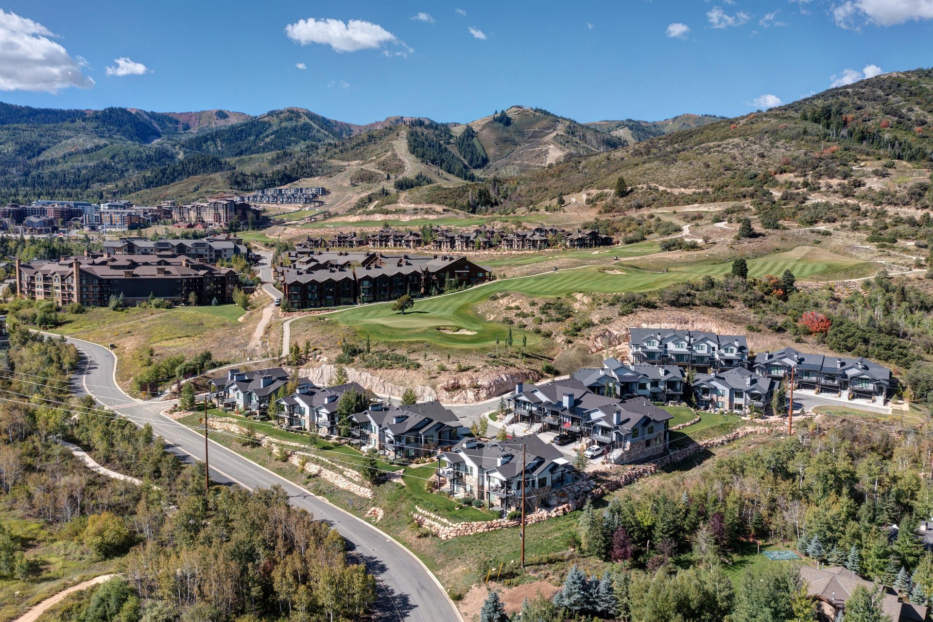 Aerial view of Frost Haven, a premier vacation rental, next to Canyons golf course and ski resort nearby.