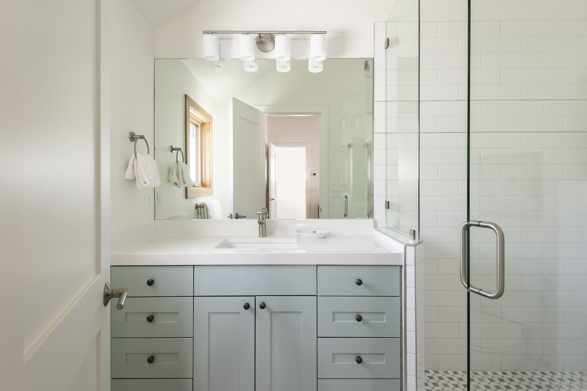 Main bedrooms ensuite bathroom with a full tiled shower and glass door.