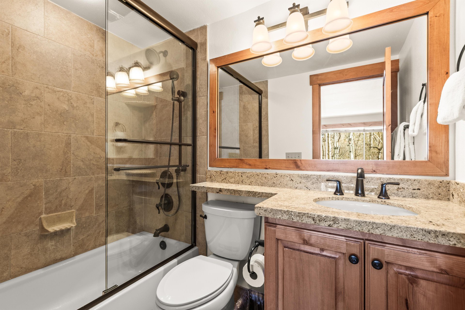 The en suite bathroom with bathtub and shower combination.