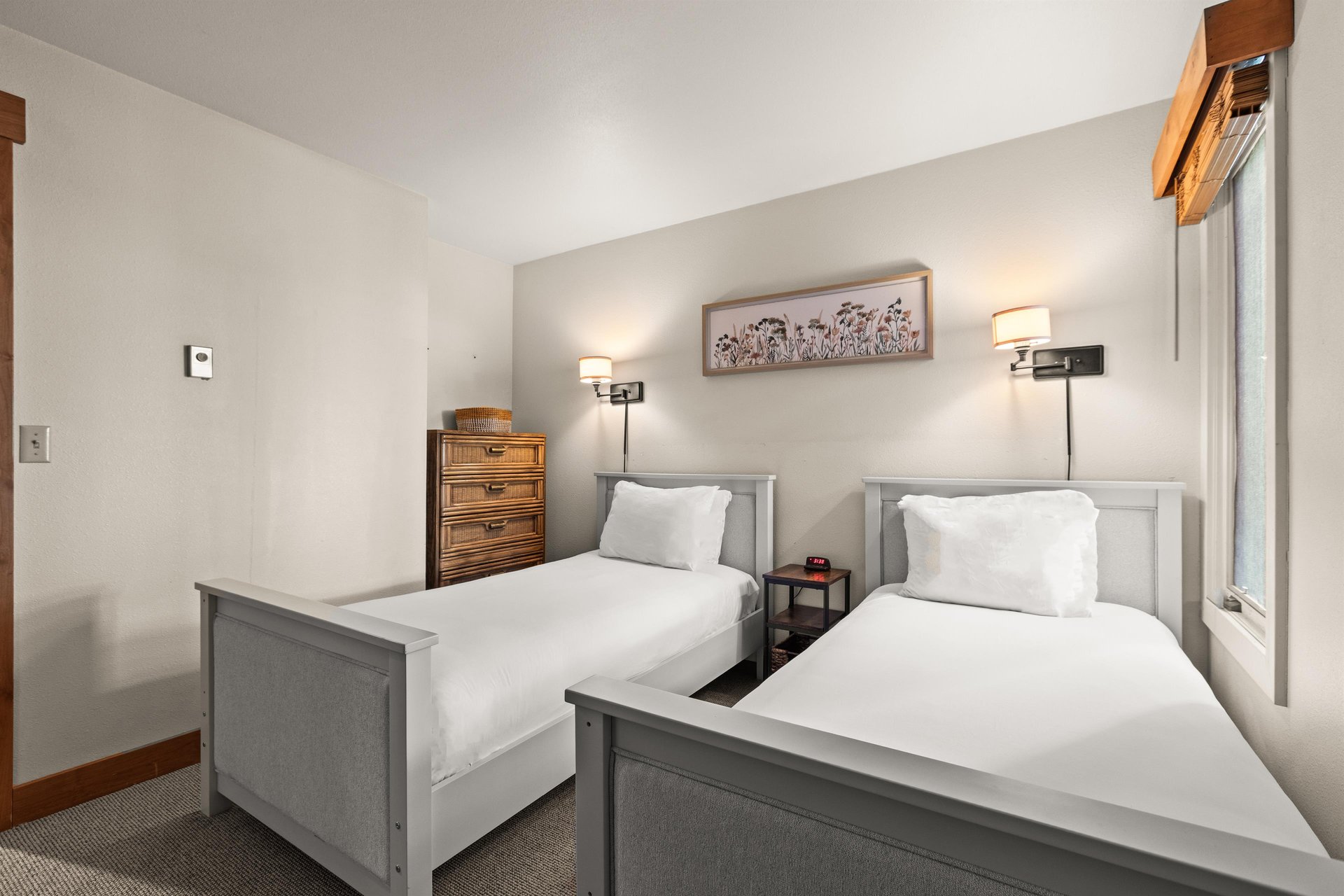 Rest peacefully in your twin bedroom with crisp white linens and wood furniture.