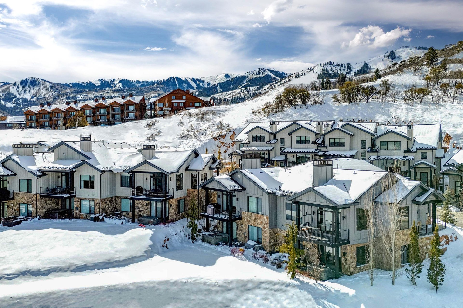 Frost Haven is nestled in the pristine snowcovered slopes in the Canyons Village with mountain backdrop.