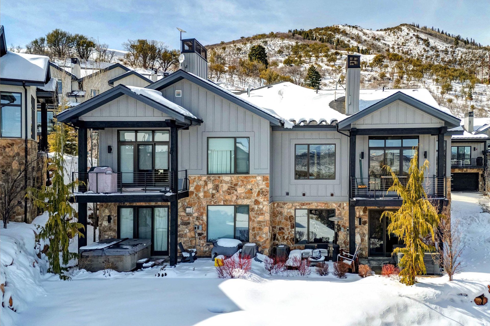 Frost Haven offers a spacious two story townhome in the Canyons Village with snowy mountains surrounding it.