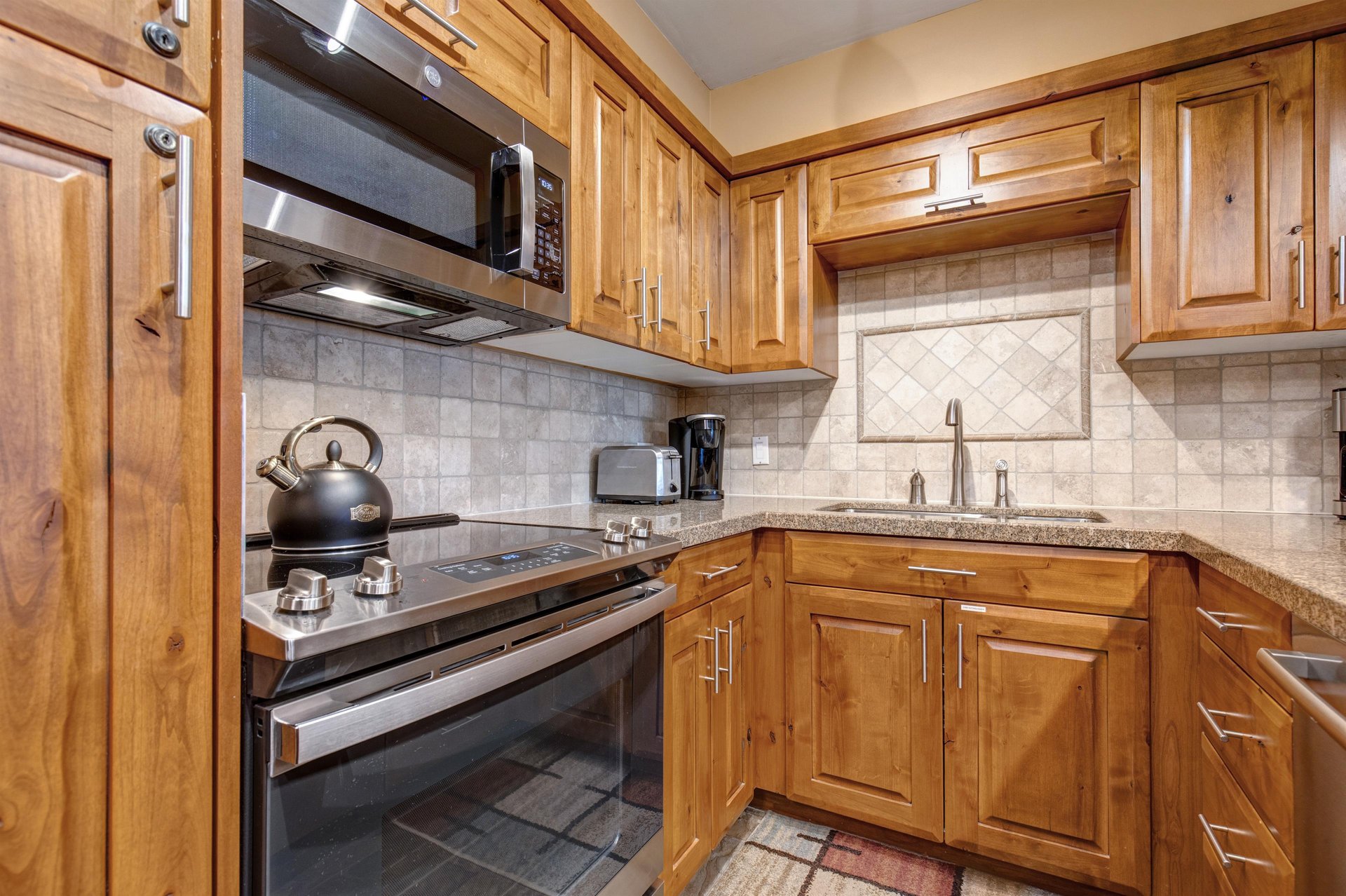 Your fully equipped kitchen features a full oven and glass stove top.