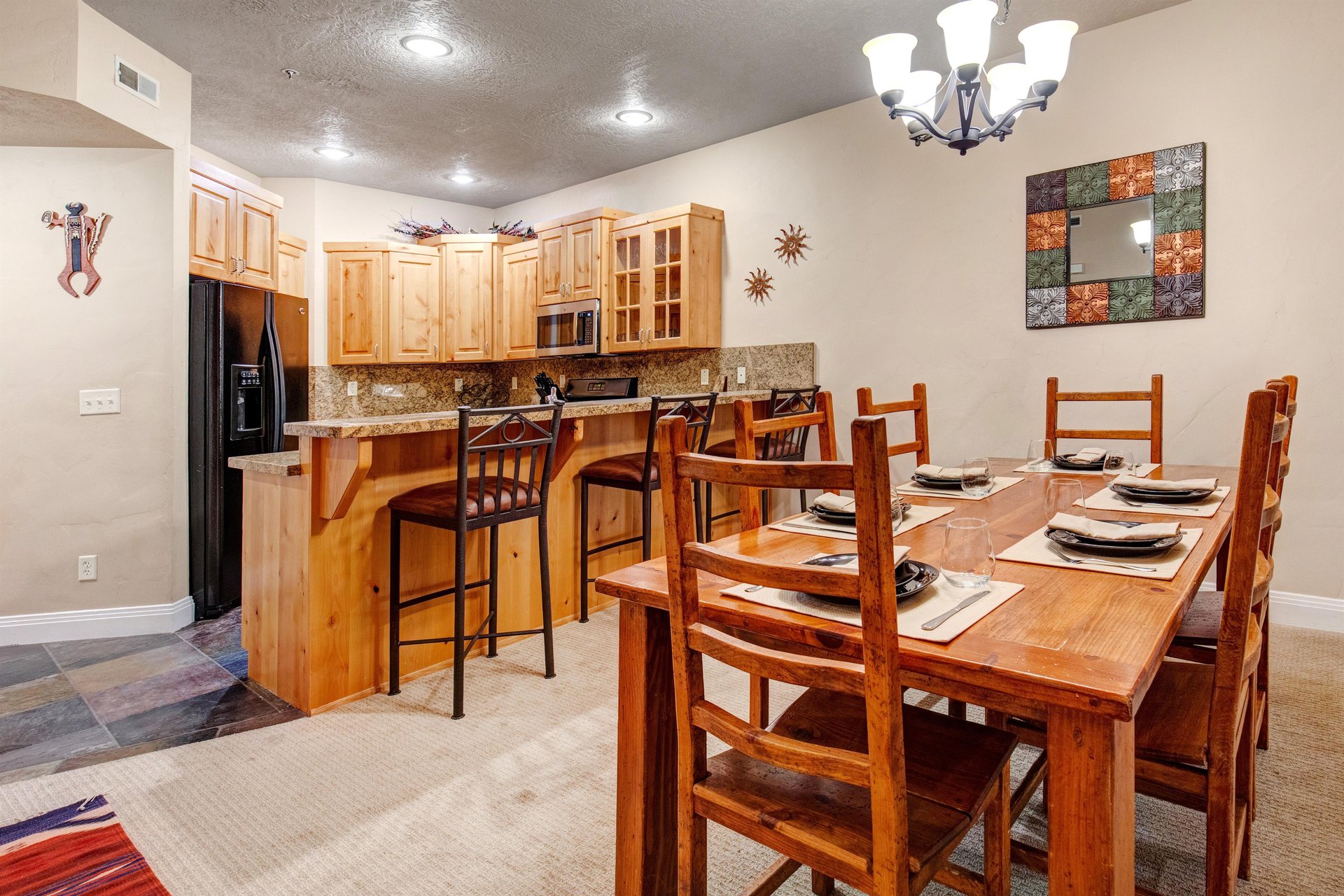 Gather around the dining table set for eight, or grab a seat at the breakfast bar in your fullyequipped kitchen—perfect for memorable meals together.
