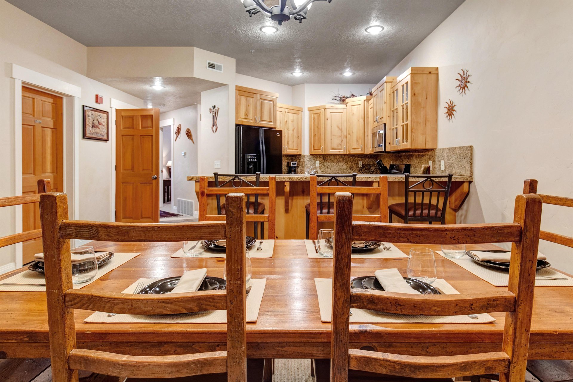 Gather around the warm, rustic dining table where memories are made over hearty meals and good company in your mountain retreat.