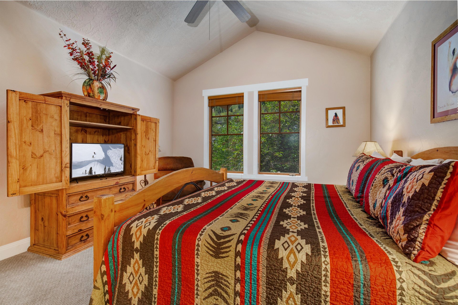 Sink into your comfortable bed with vibrant Southwestinspired linens and unwind in front of the TV after a day of mountain adventures.