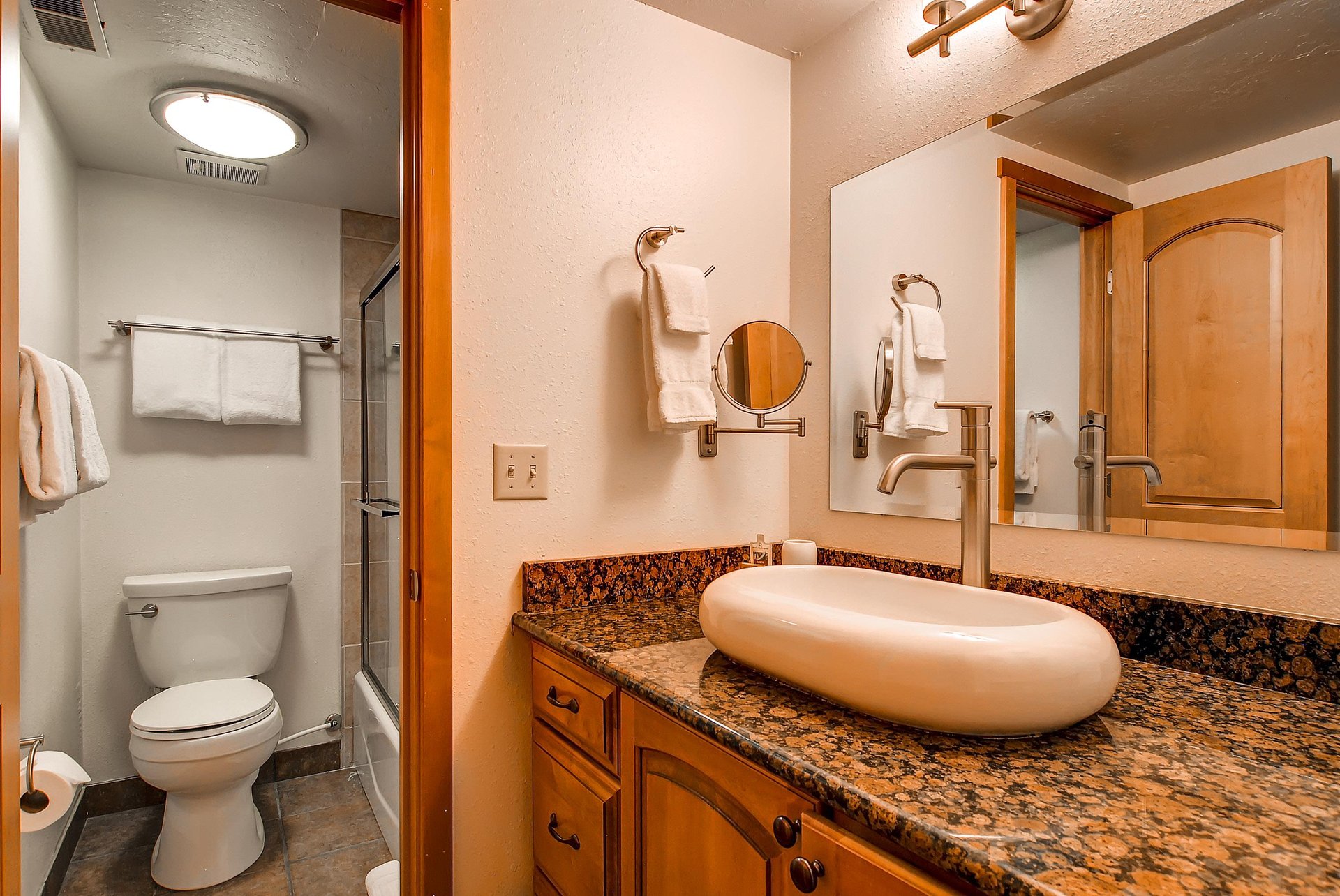 The shared bathroom has a single sink vanity and separate water closet.