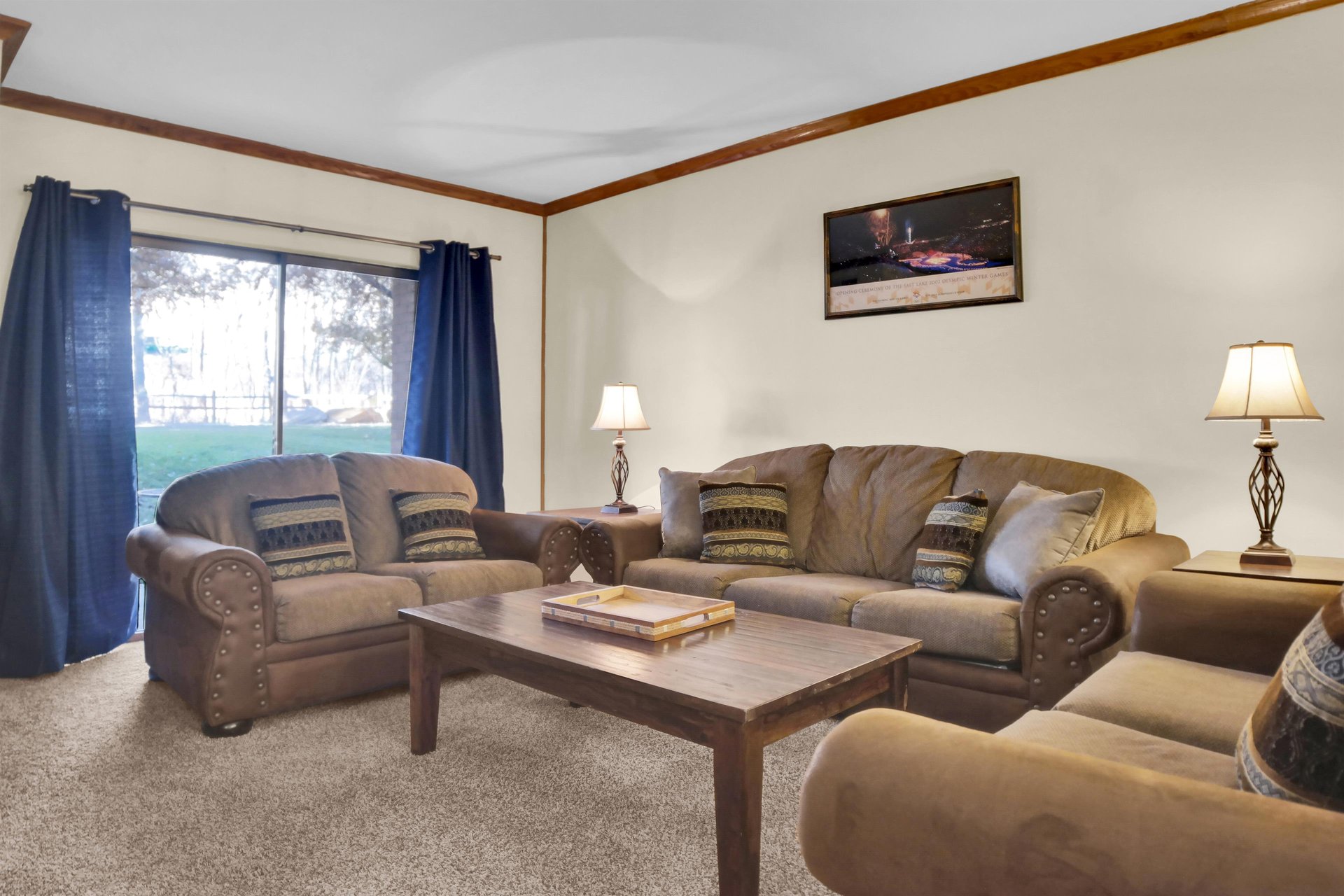 Park Station 214 has a living room with large sliding glass doors allowing plenty of natural light and comfortable couches.