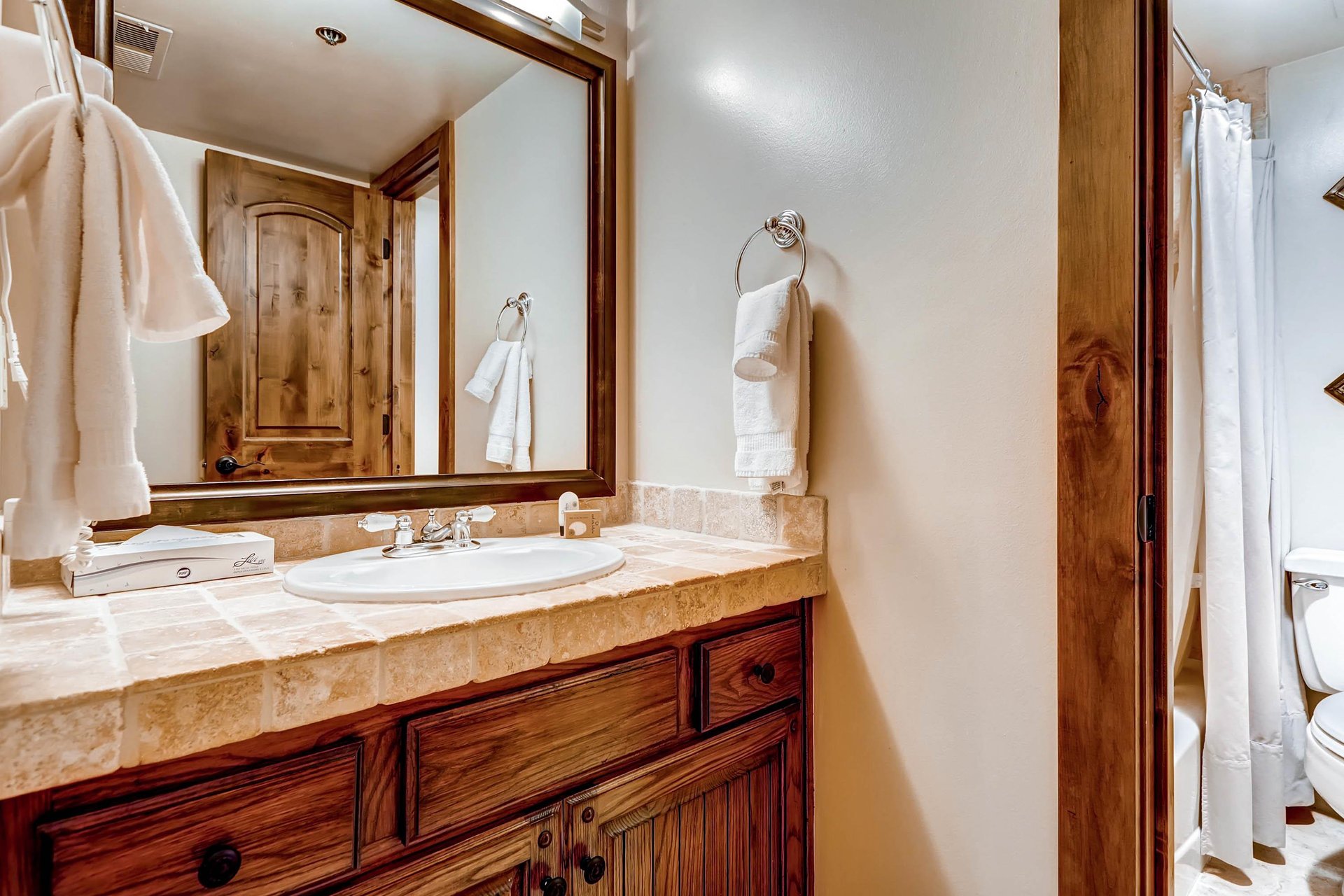 The shared bathroom has a single sink vanity.