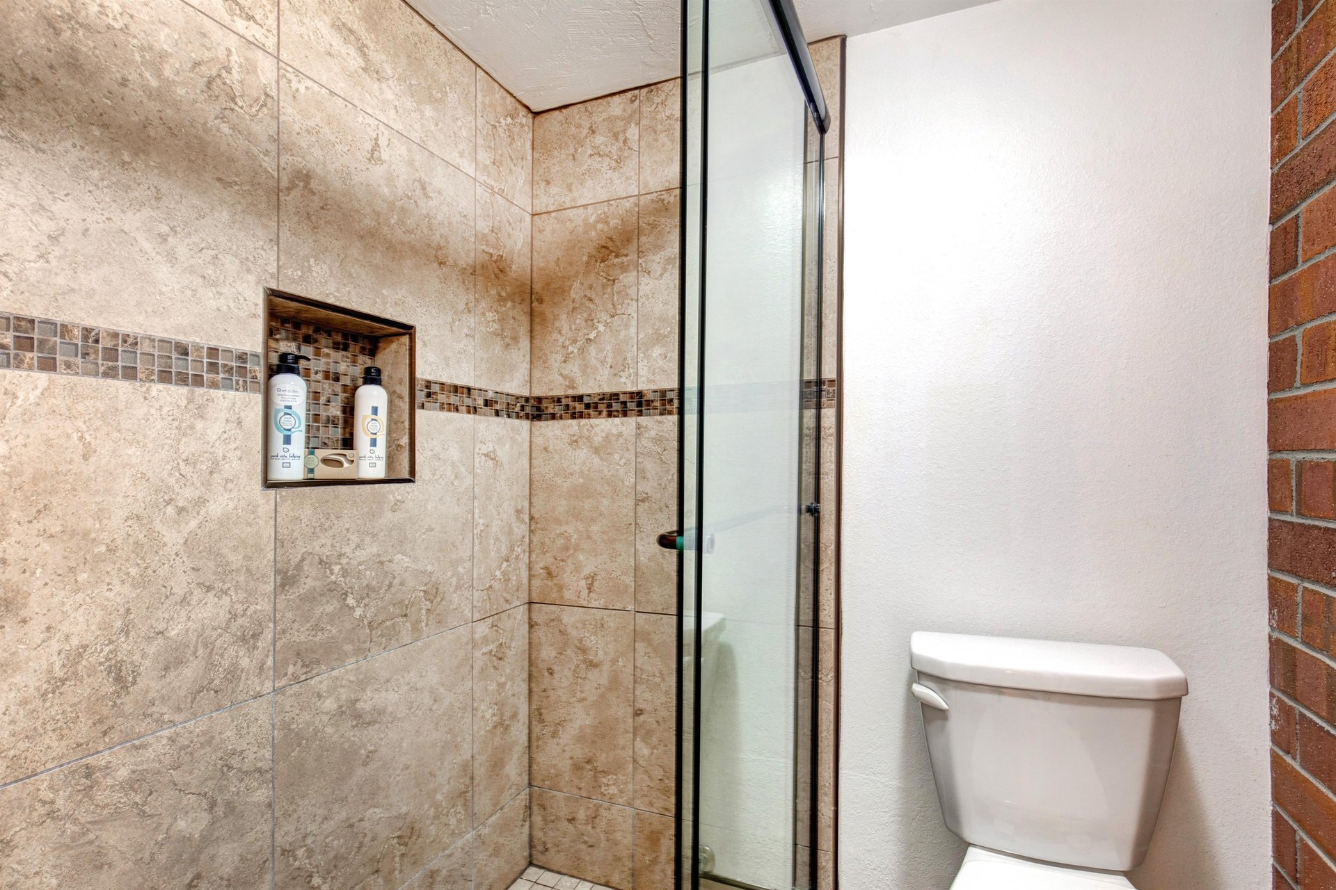 The shared bathroom has a walk in shower.