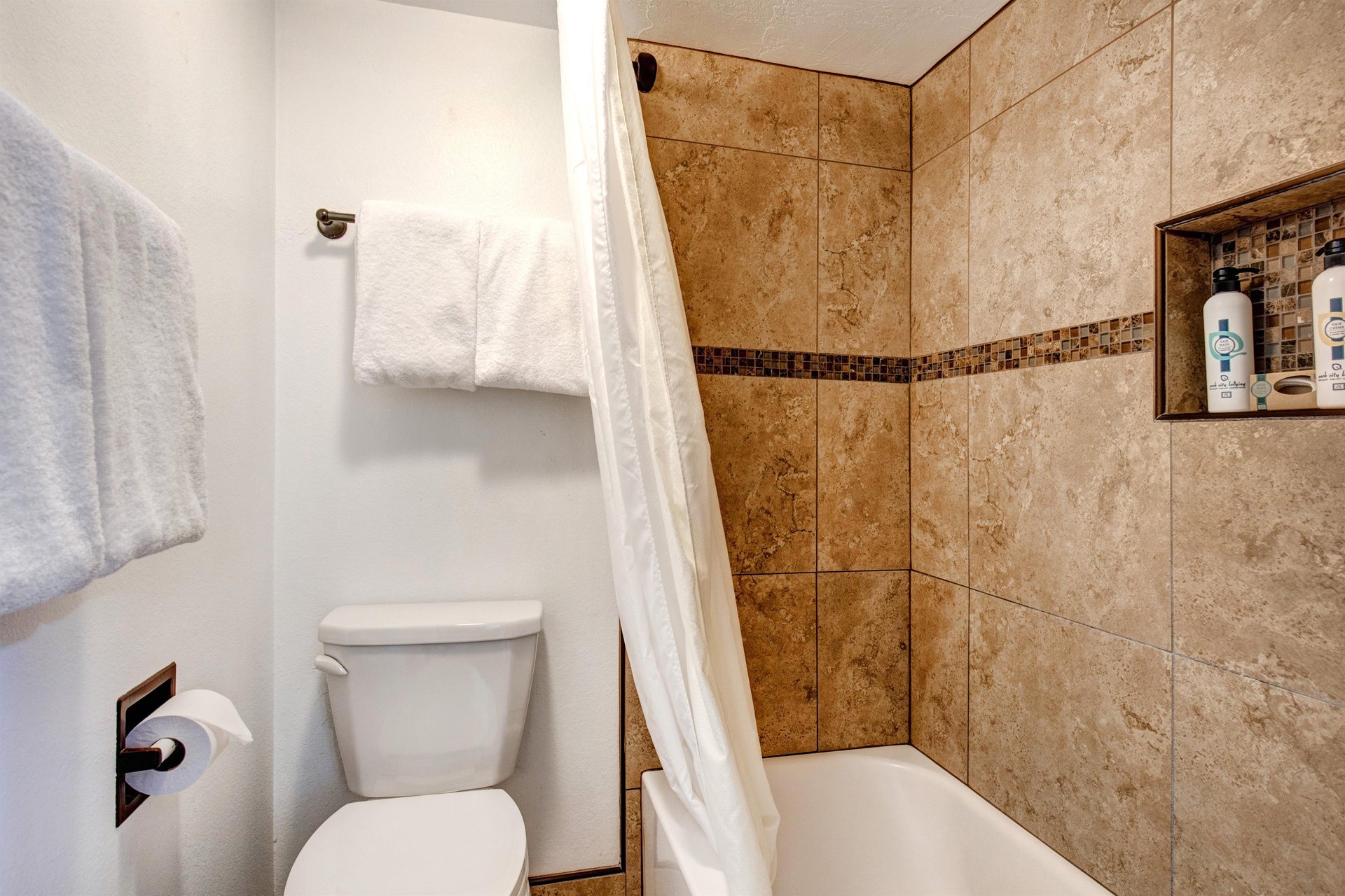 The shared bathroom has a single sink vanity and separate water closet.