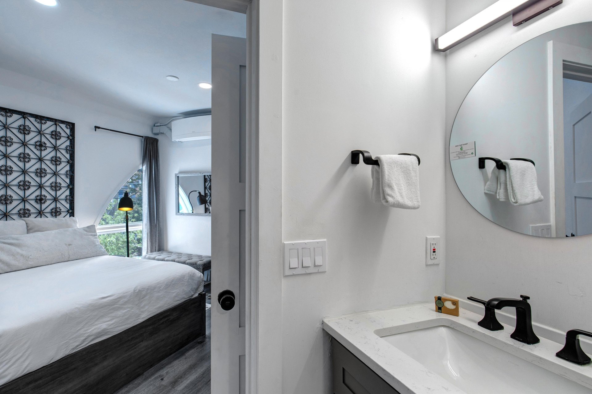 The en suite bathroom with a single sink vanity.