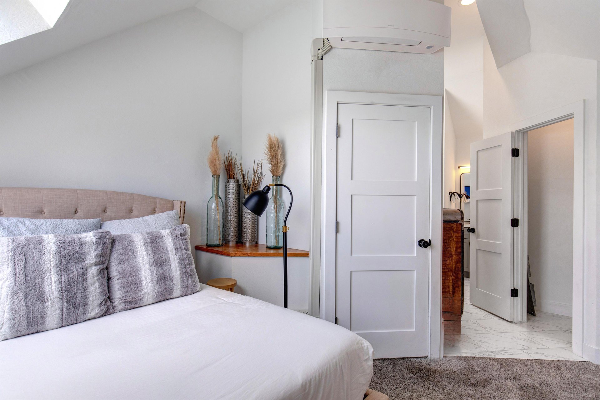 The second bedroom with a queen size bed.