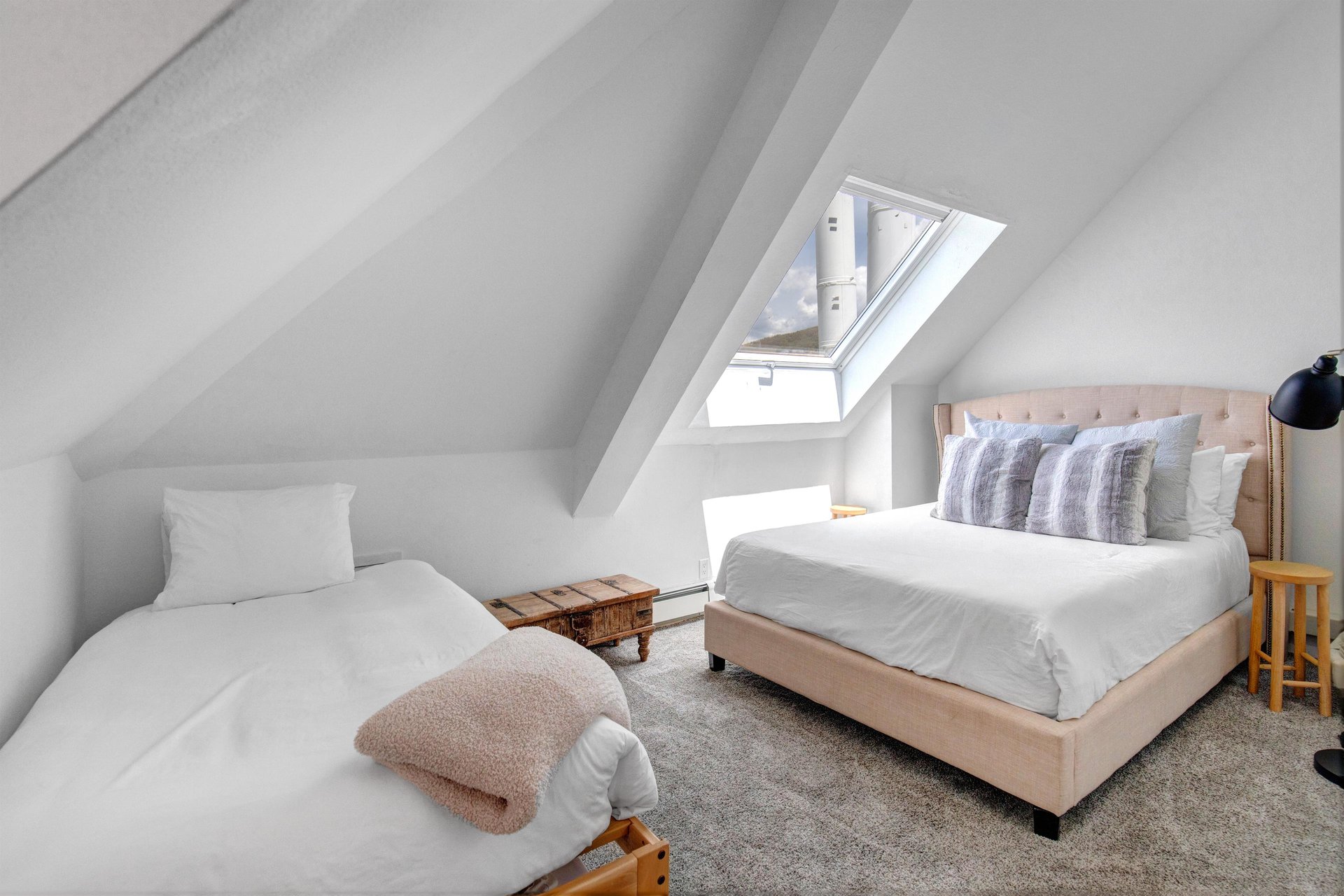 The second bedroom with a queen size bed and twin bed.
