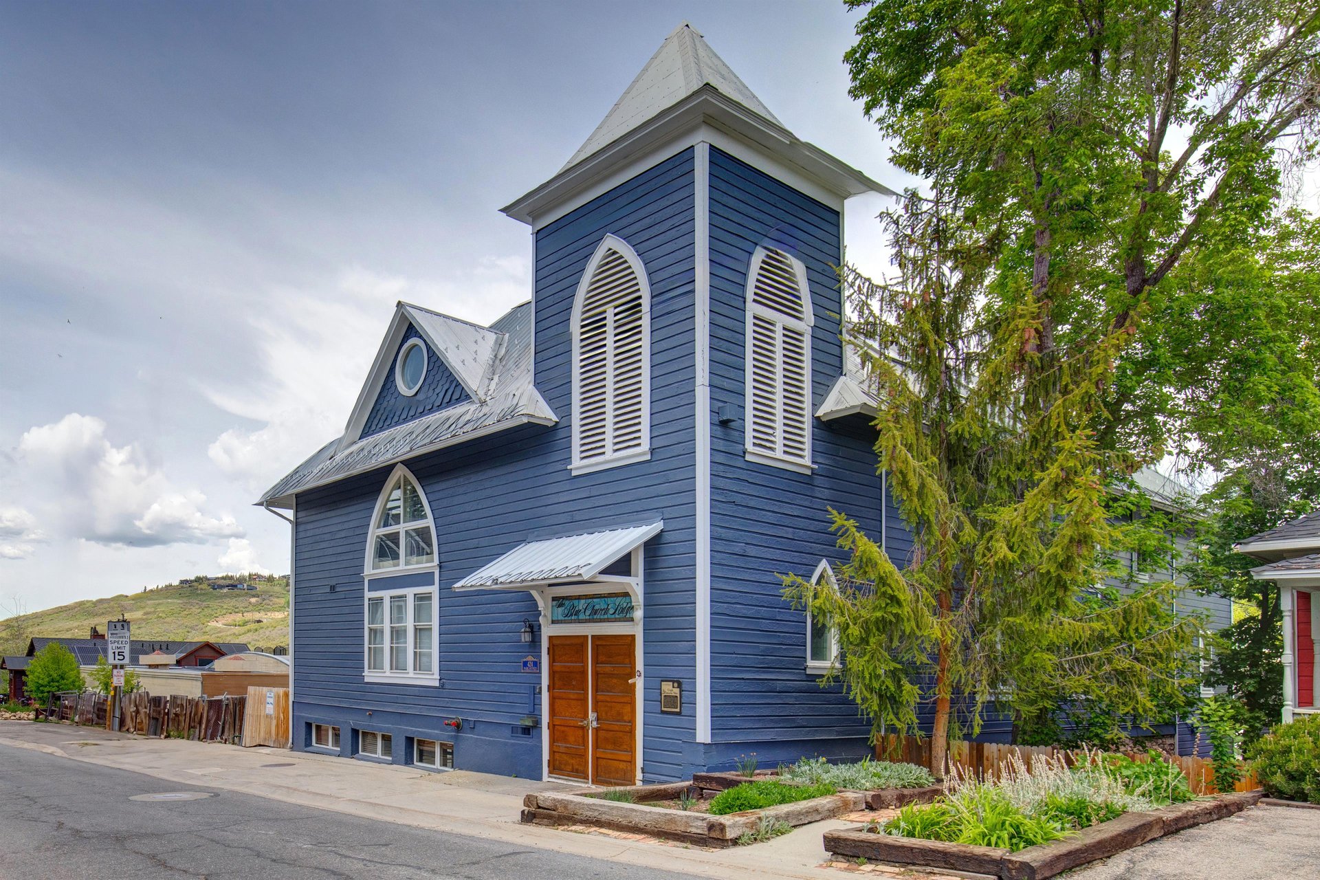 The exterior of the historic Blue Church Lodge which offers beautifully restored vacation rentals in the heart of historic Park City, Utah.