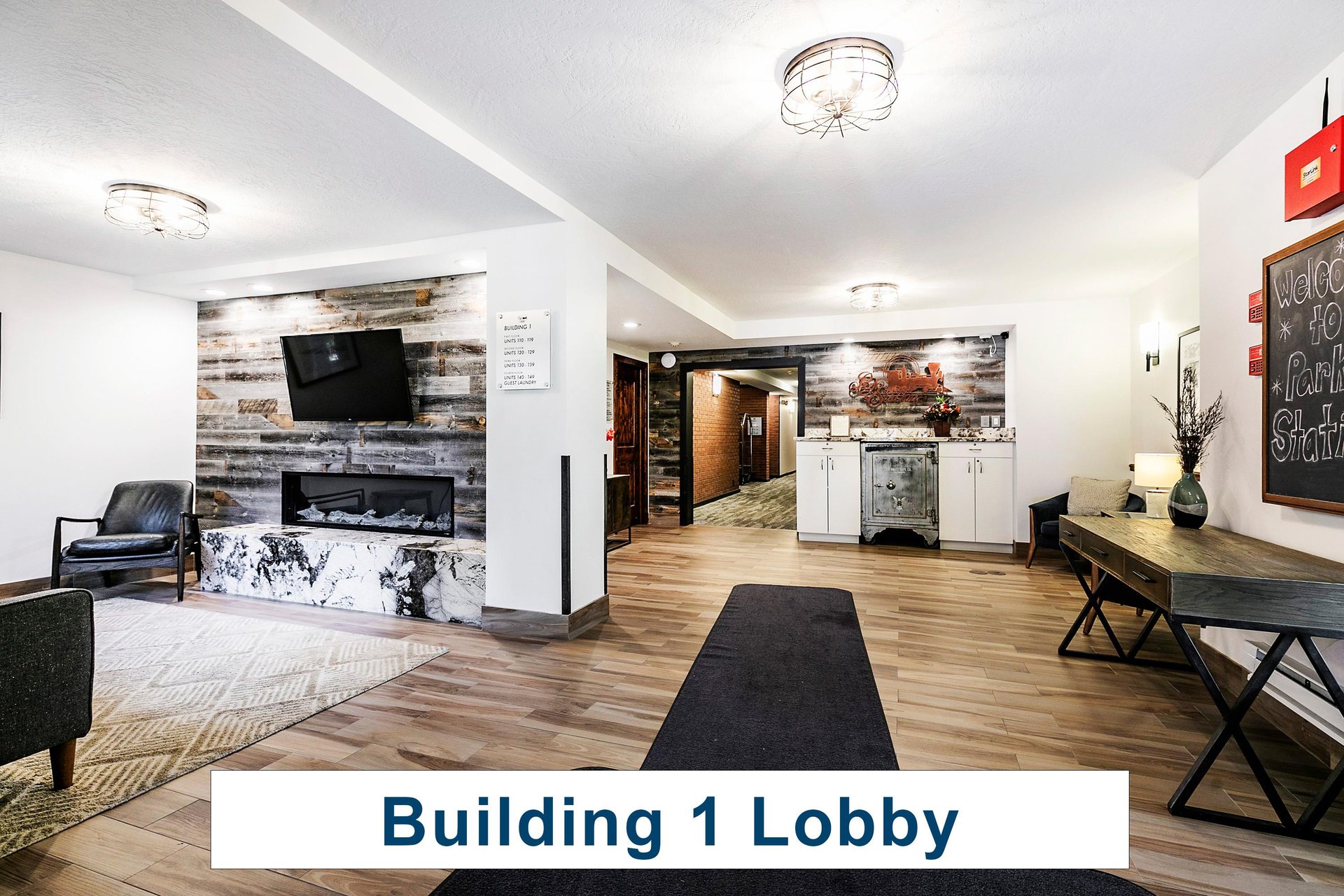 Building 1 lobby entrance with sitting area next to a storage area.