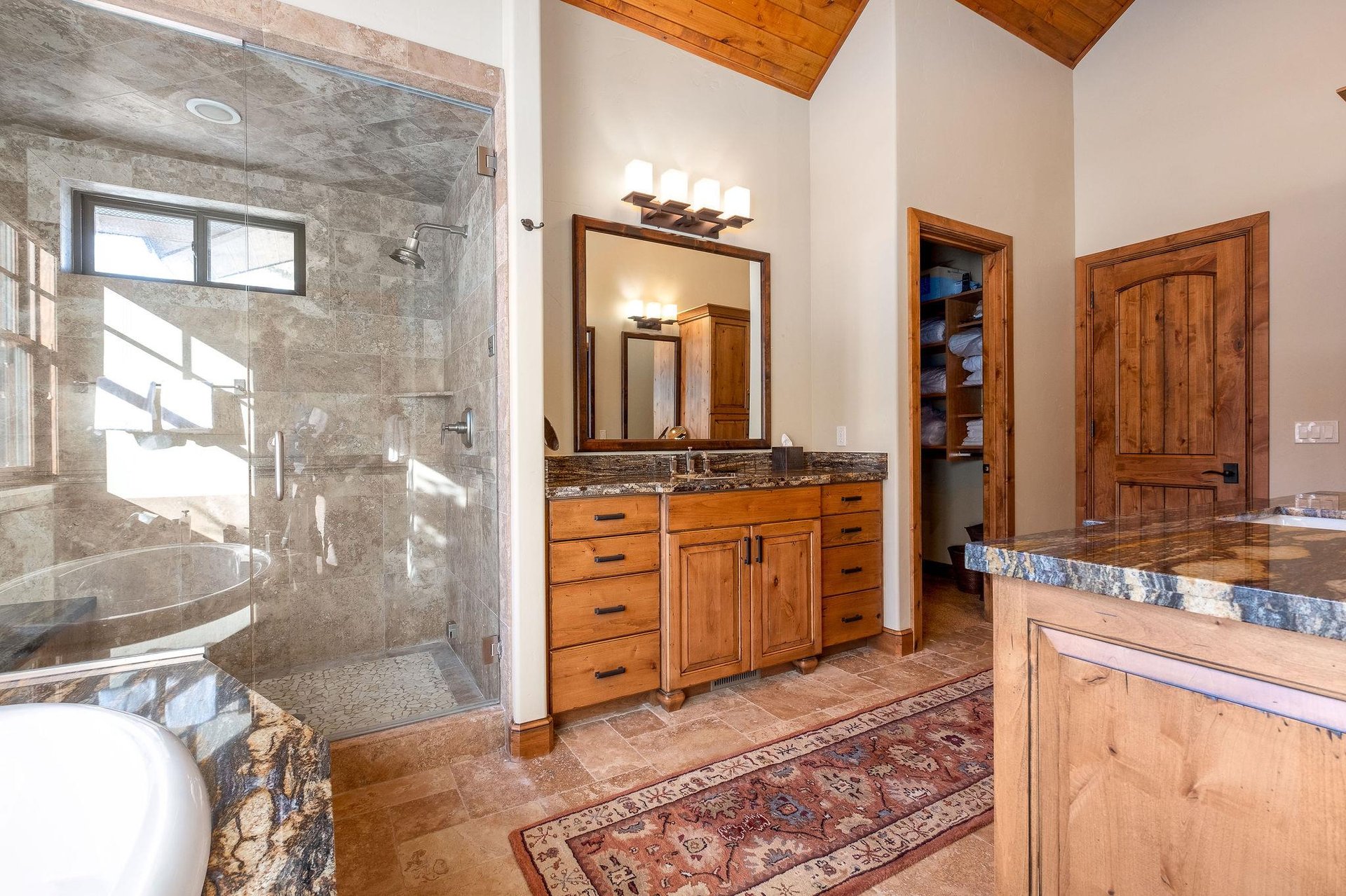 Luxurious bathroom with walk in closet