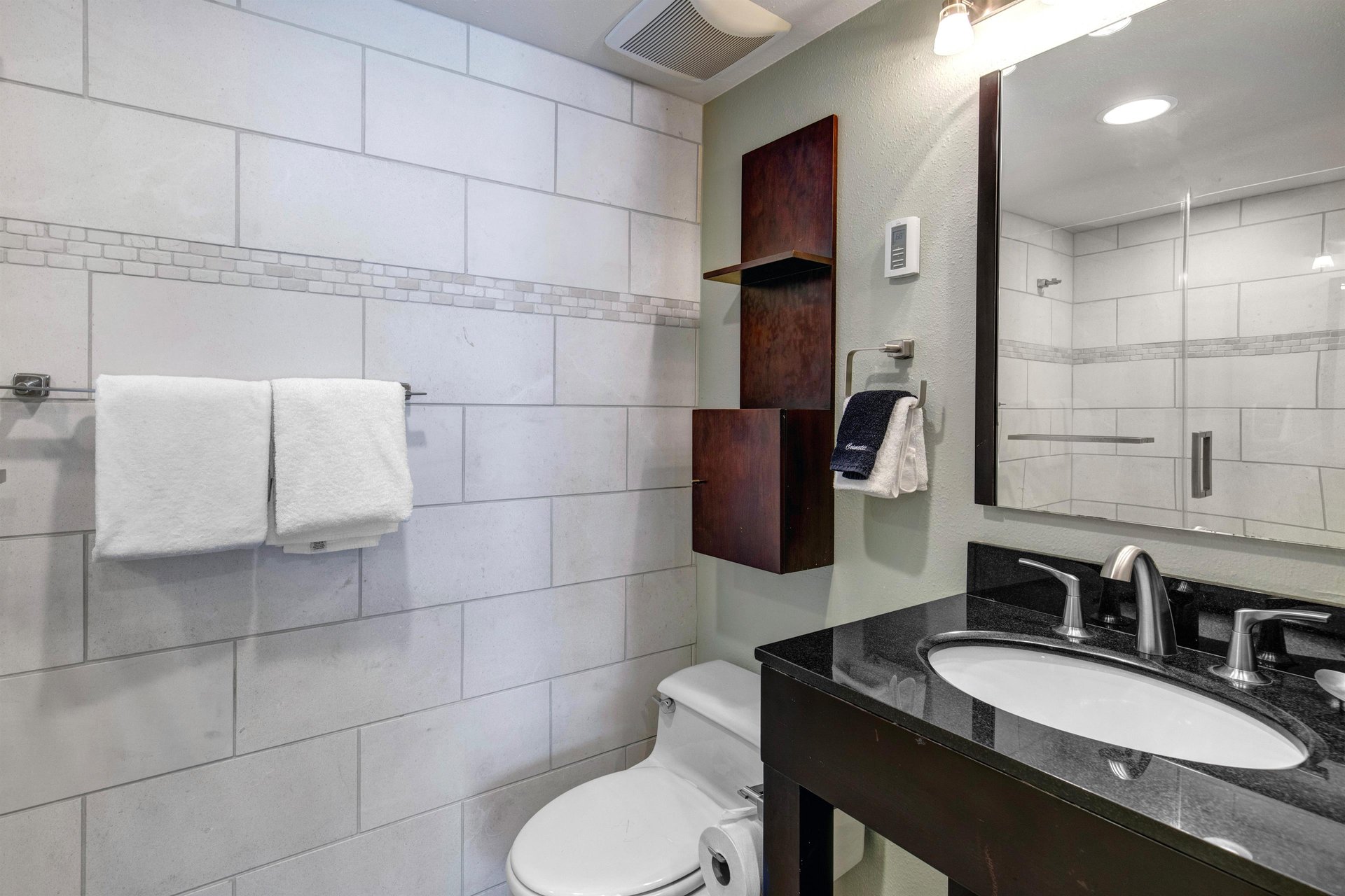 The en suite bathroom with a single sink vanity.