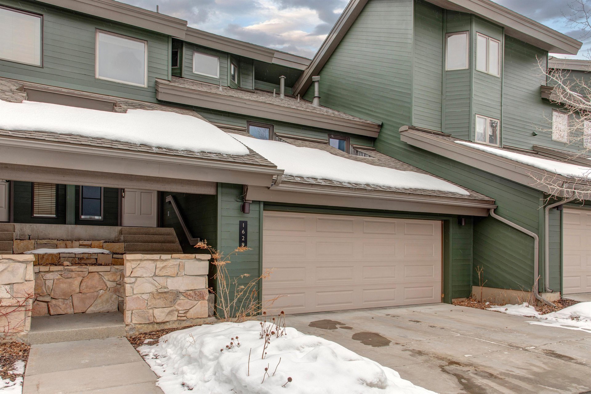 The entry to the property with a two car garage.