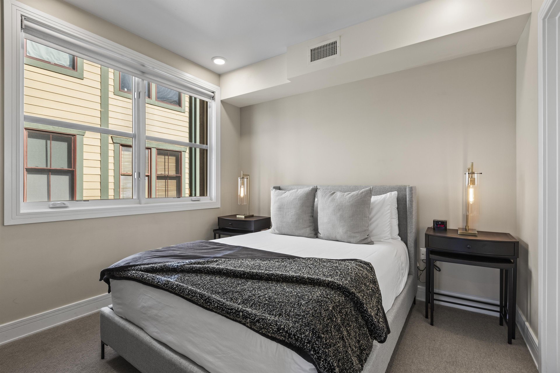 The second bedroom with a queen size bed.