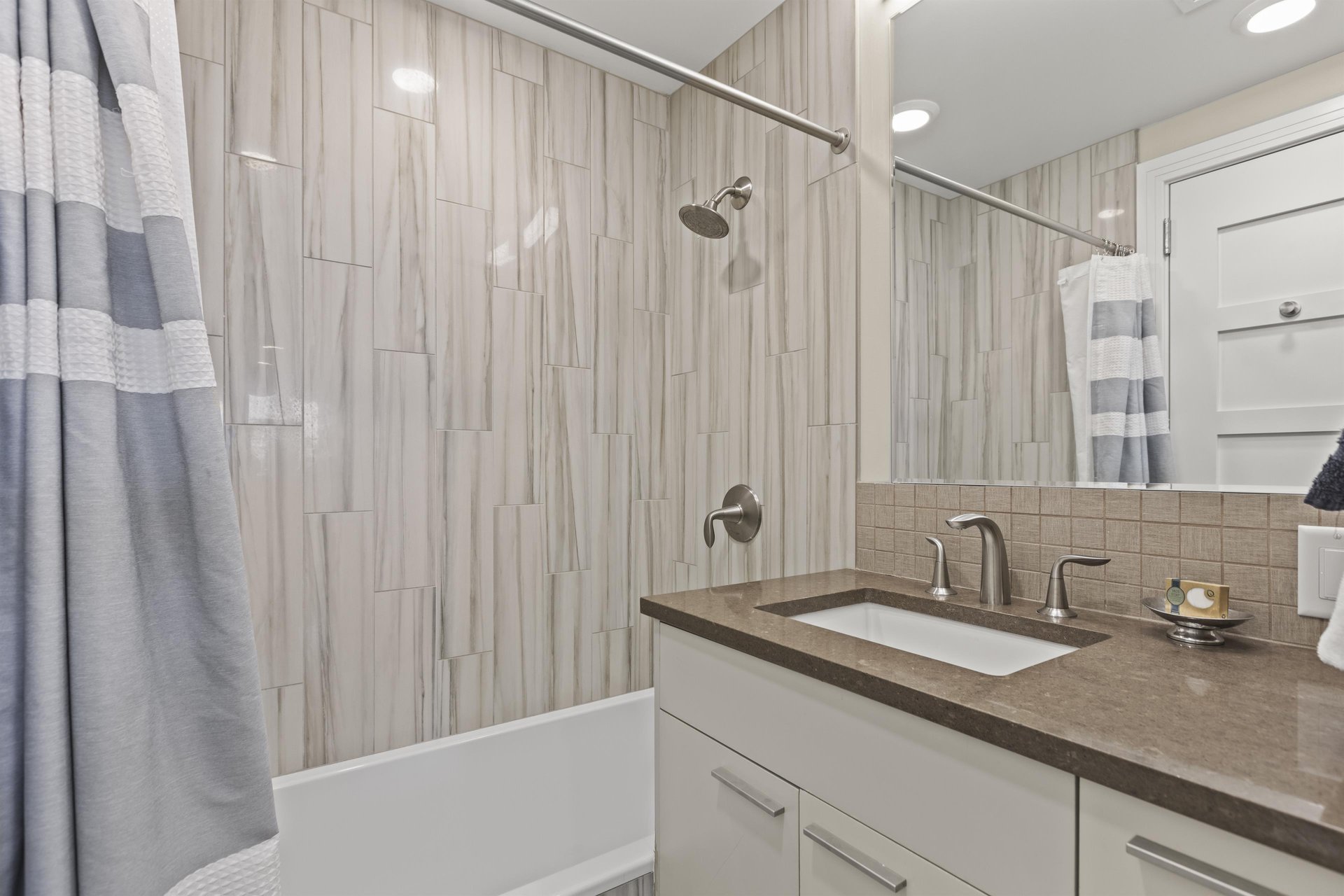 Bathroom two with a bathtub and shower combination.