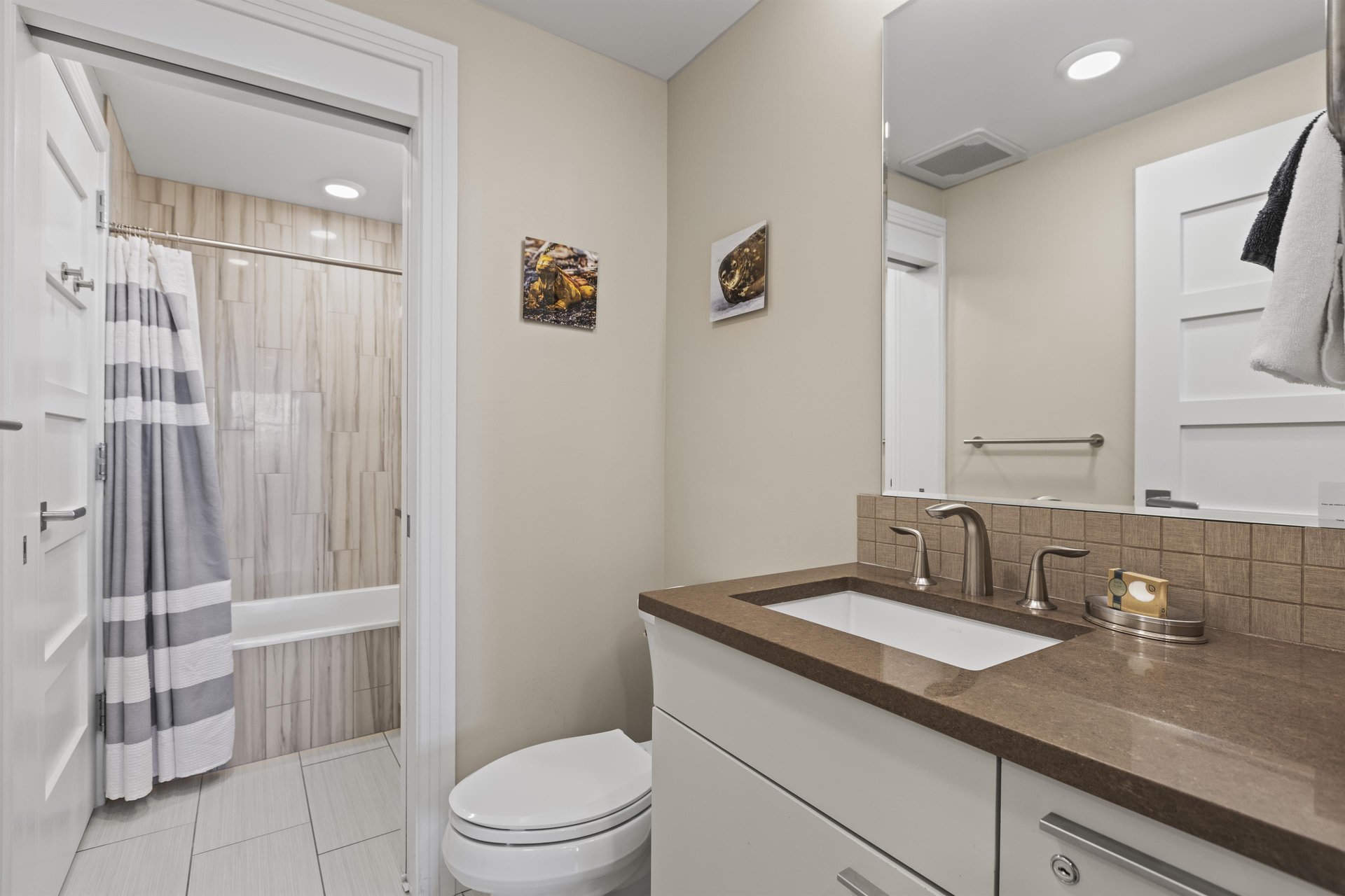 Bathroom two with a bathtub and shower combination.