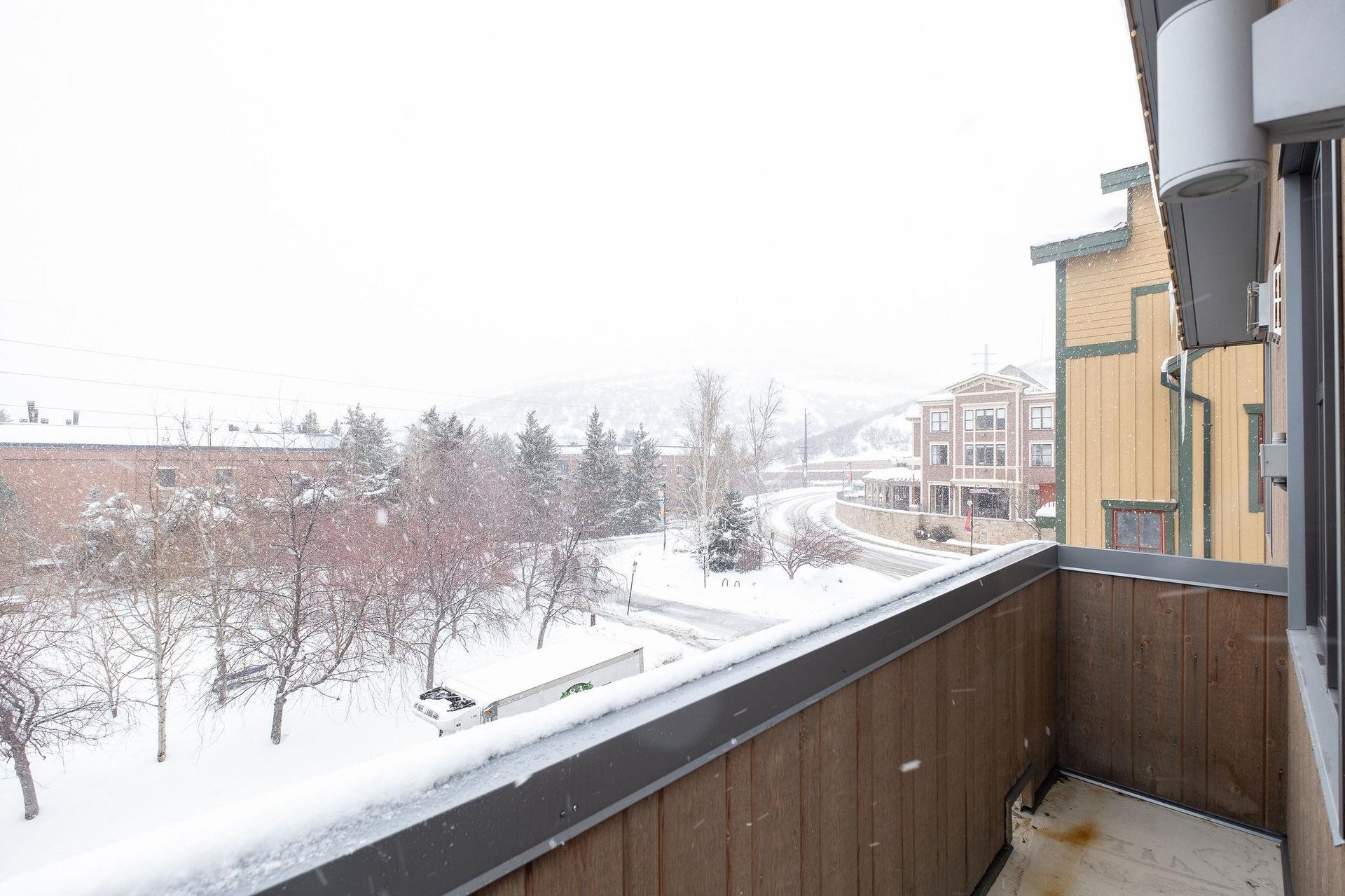 Private patio views of lower Main Street during a classic Park City snowstorm