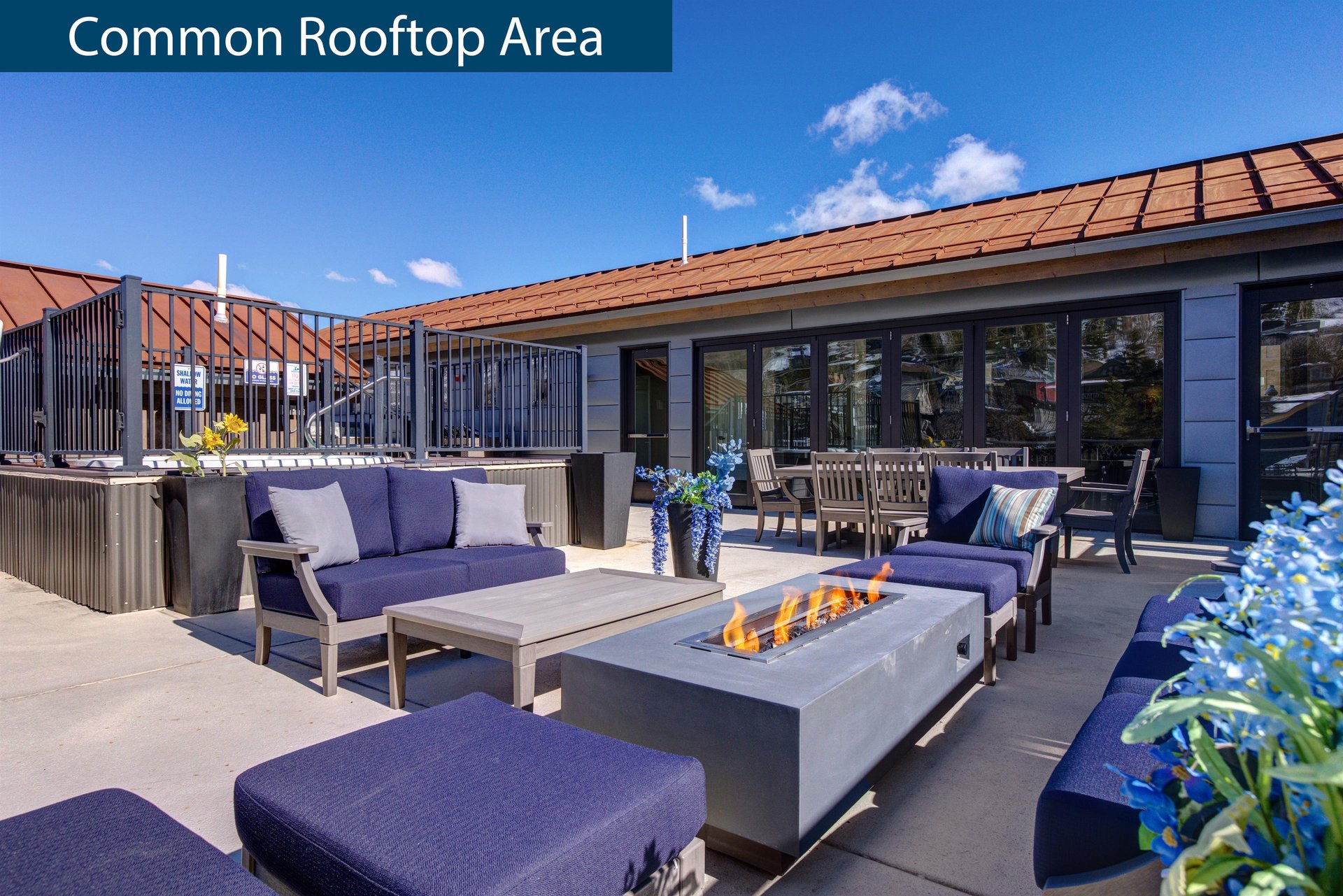 Rio Grande rooftop sitting area with fire table.