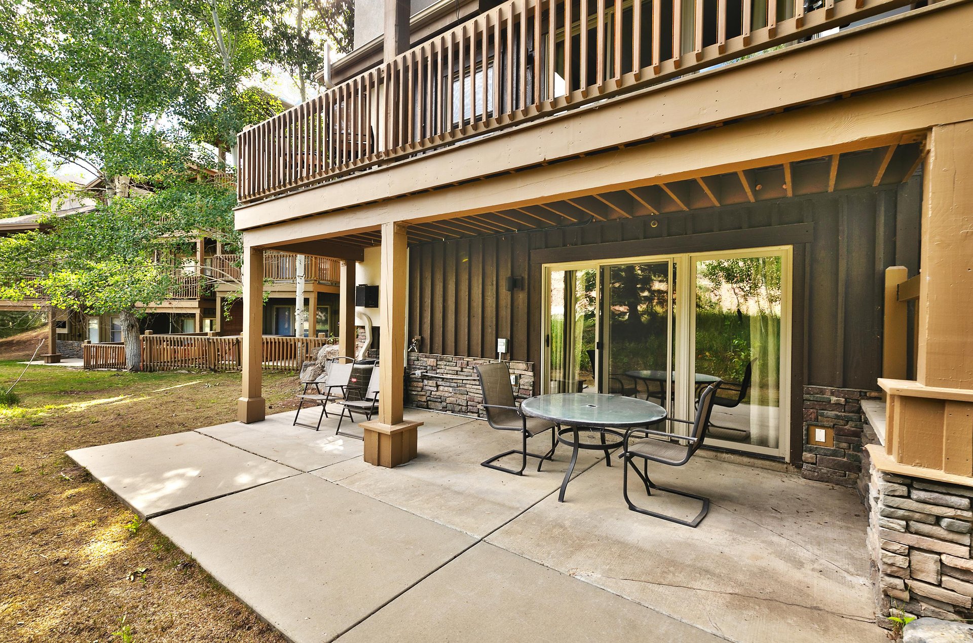 Lower level private patio with table and chairs