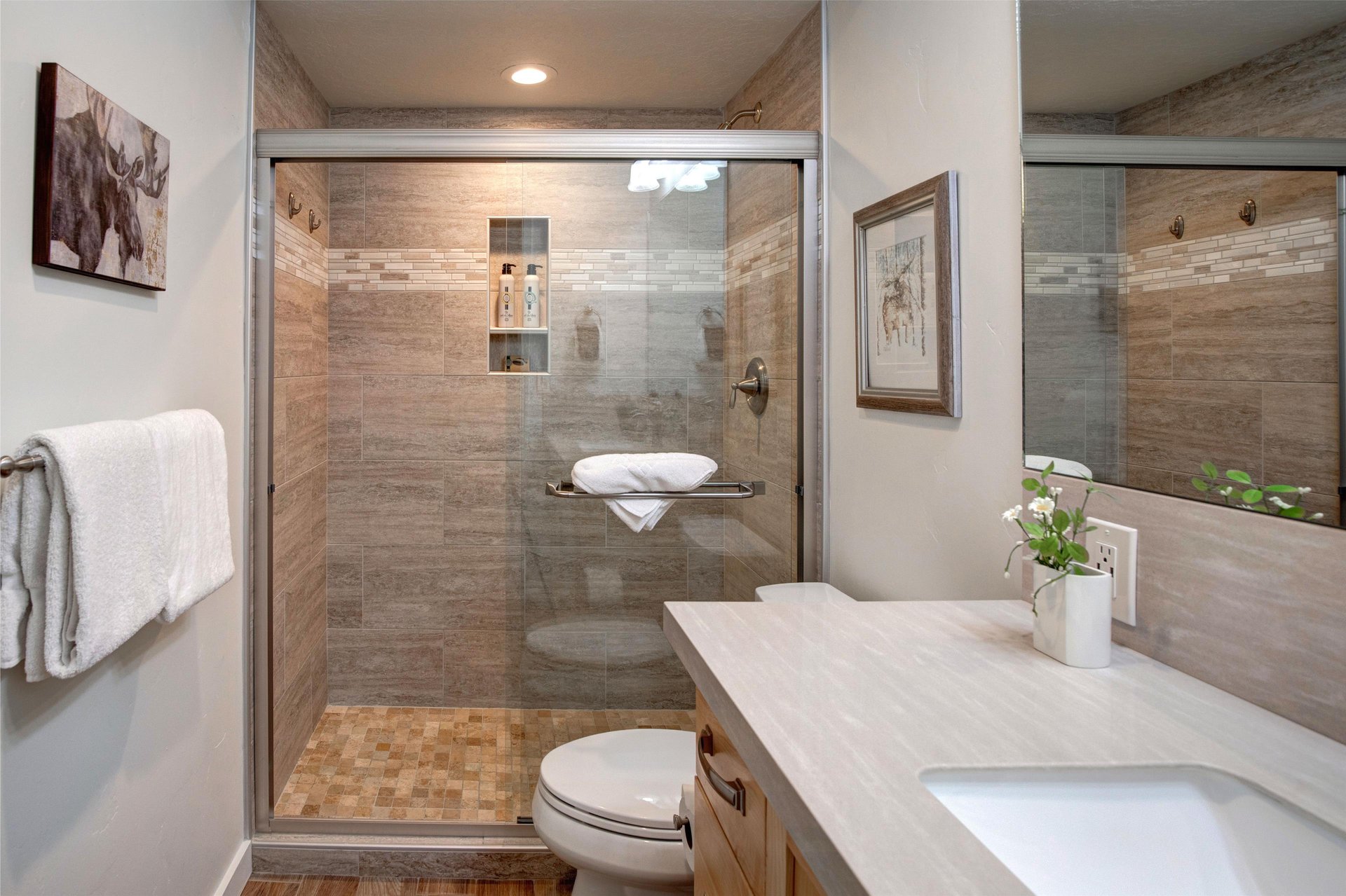 Unwind in your beautifully appointed bathroom featuring a spacious walkin shower with premium tile work and modern fixtures for your comfort.