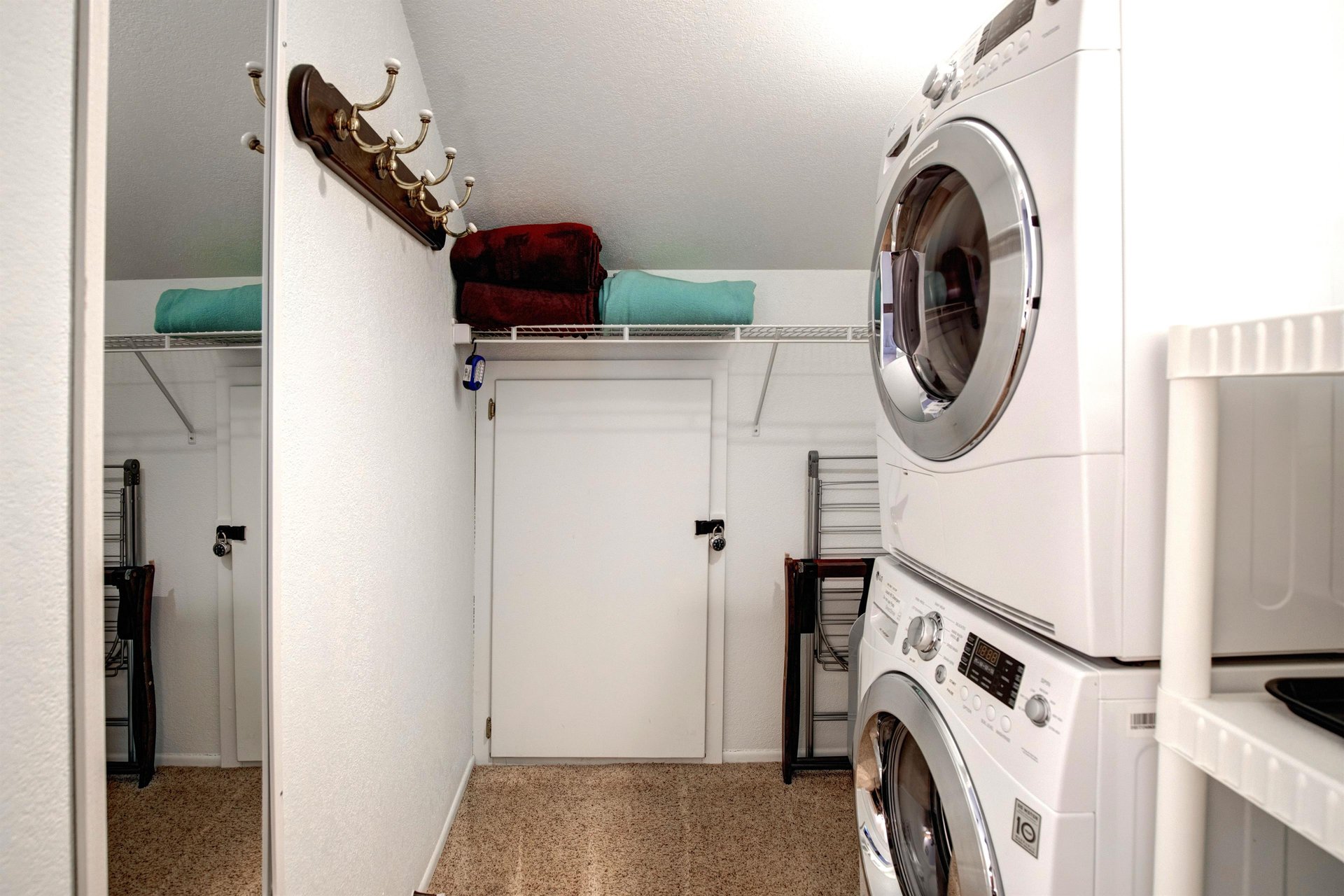 Your dedicated laundry room features a convenient stacked washer and dryer with ample storage space for all your vacation essentials.