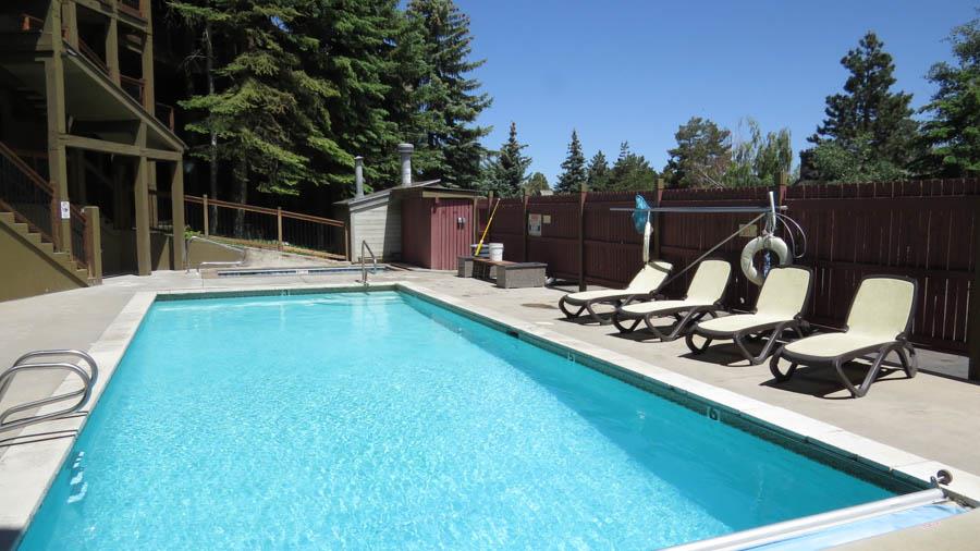 Snowcrest pool on a beautiful summer day, plenty of lounge chairs plus a jacuzzi