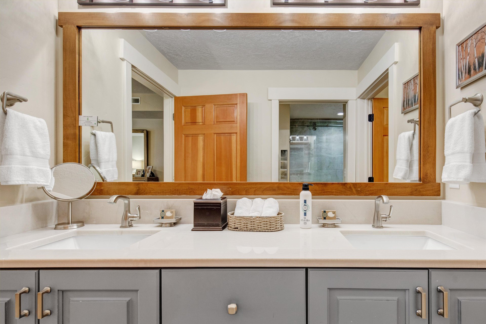 This dualvanity bathroom welcomes you with crisp white counters, plush towels, fresh amenities, and a spacious modern design that makes your morning routine feel effortlessly luxurious.
