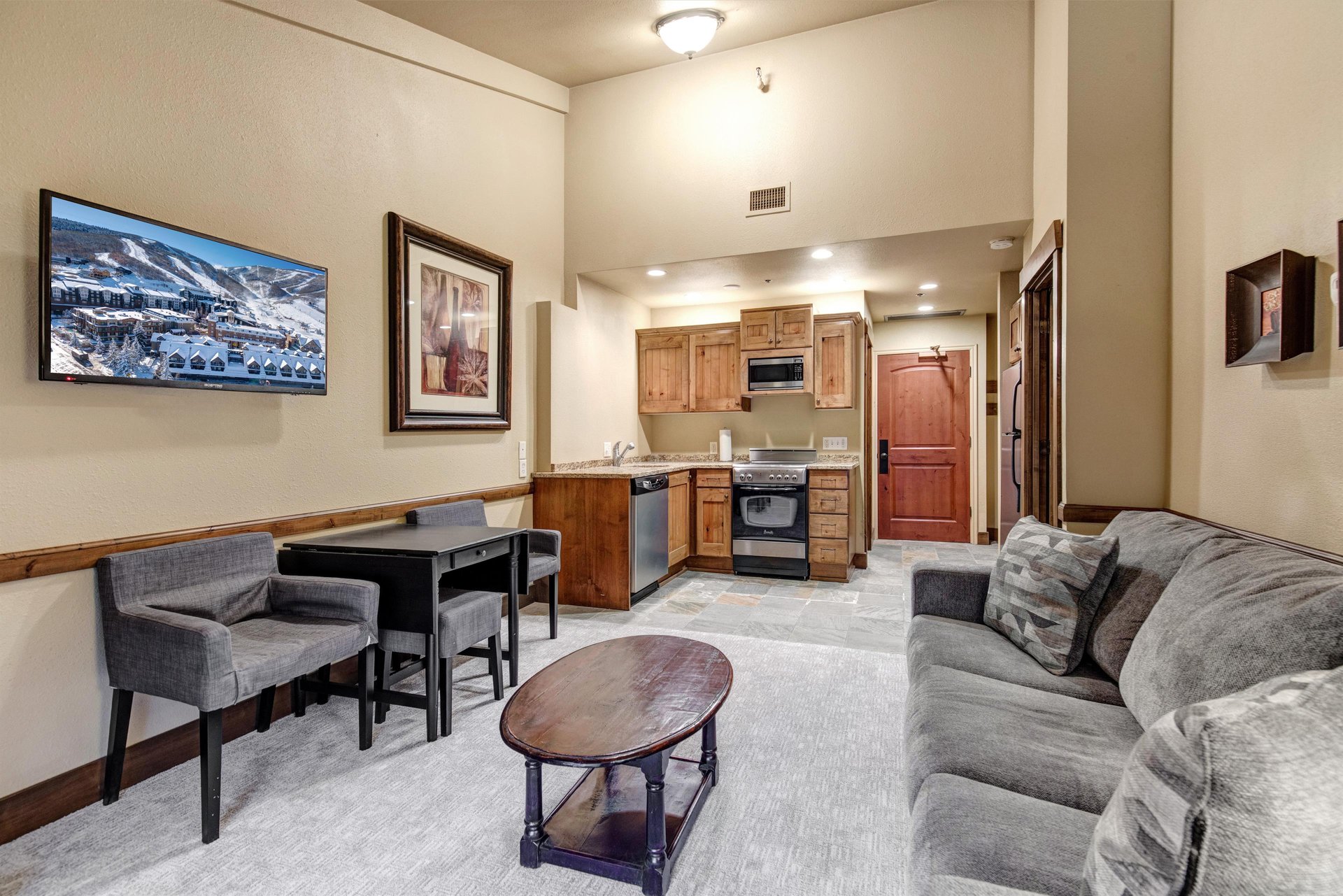 Sink into your plush sofa while enjoying the openconcept layout connecting your cozy living space to your fully equipped kitchen.