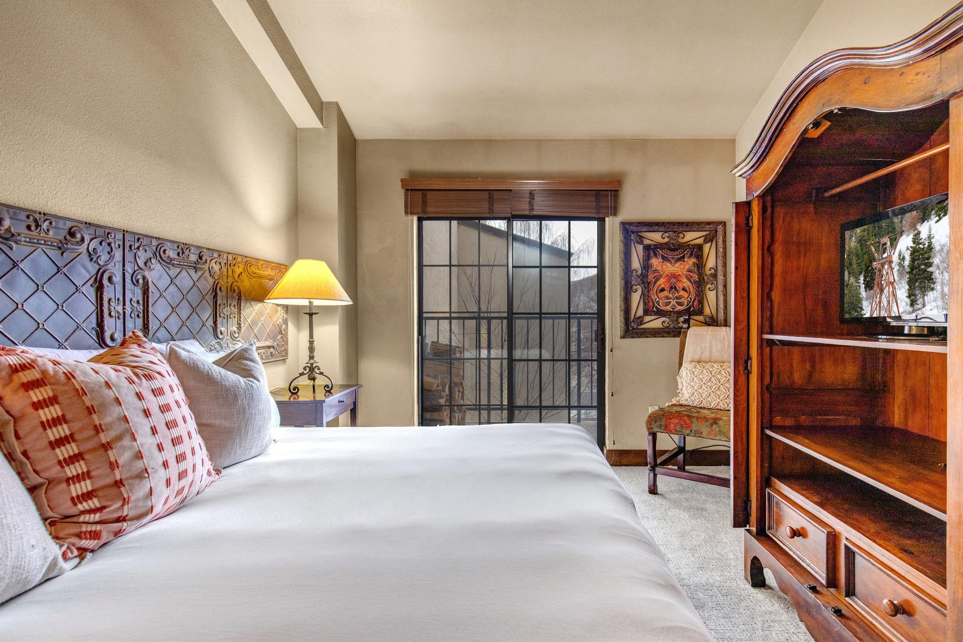 Unwind in your elegant bedroom featuring crisp linens and a king size bed.