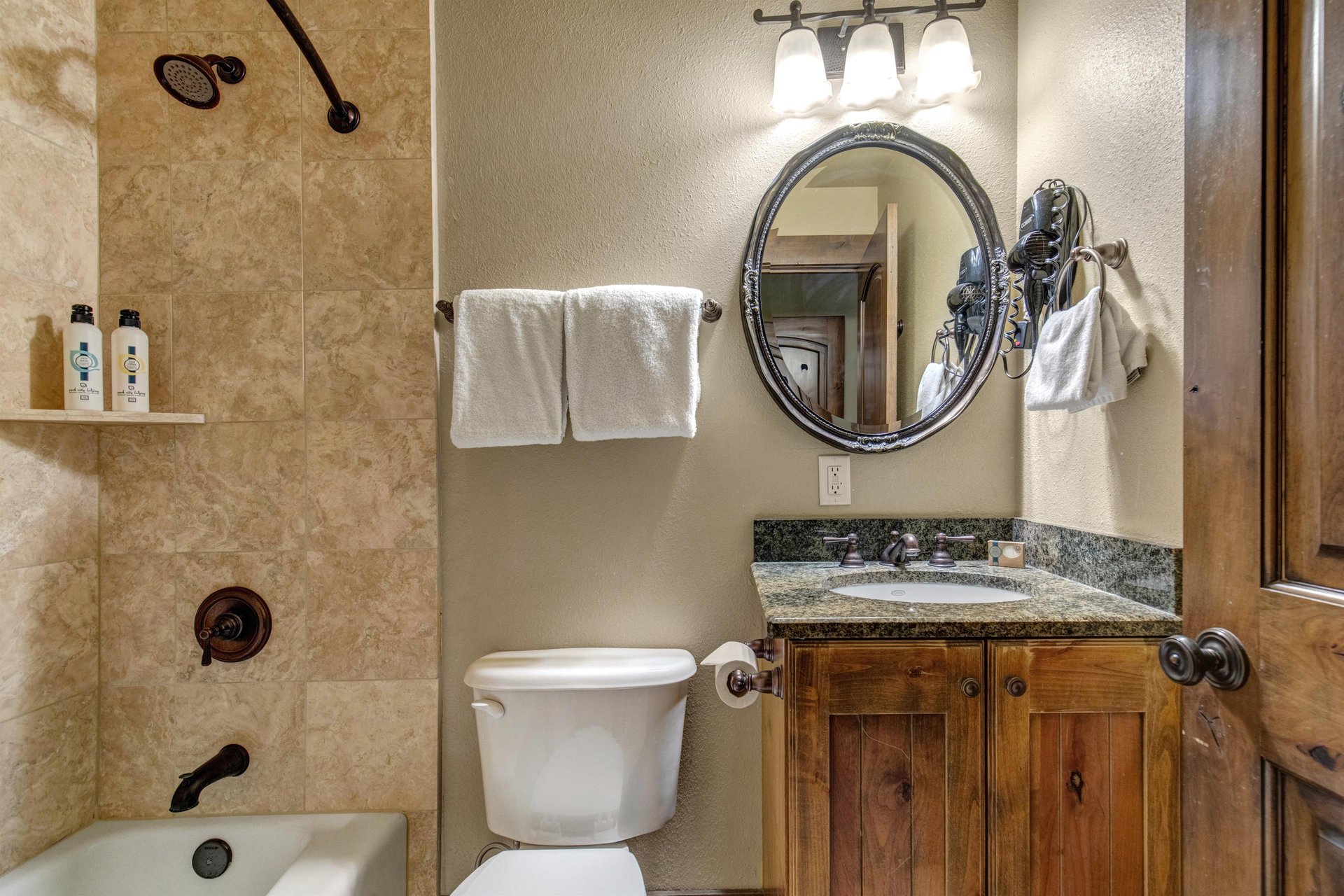Your en suite bathroom with a bathtub and shower combination.