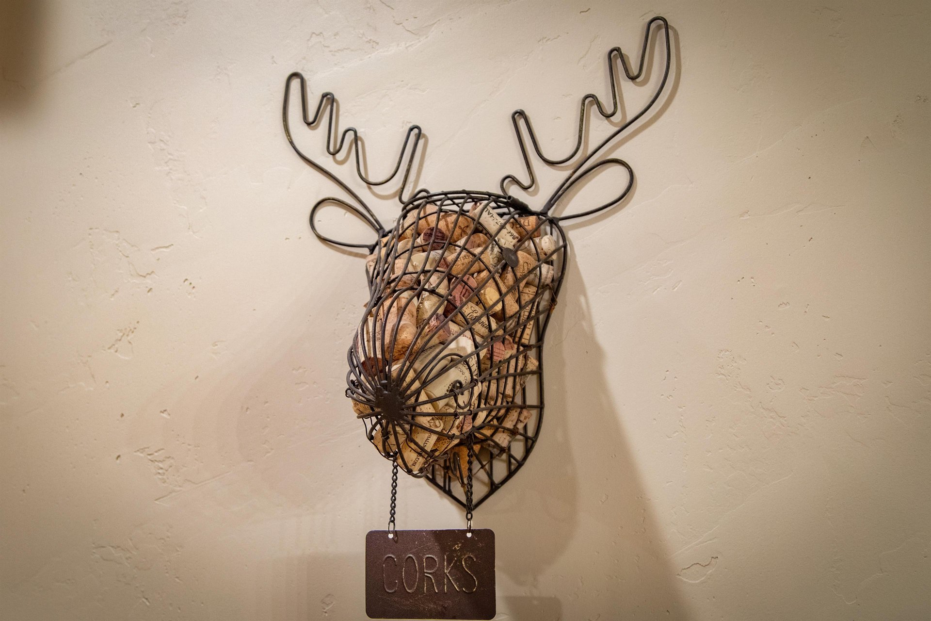 Fun mountain style decor in the kitchen, wire moose to hold wine corks