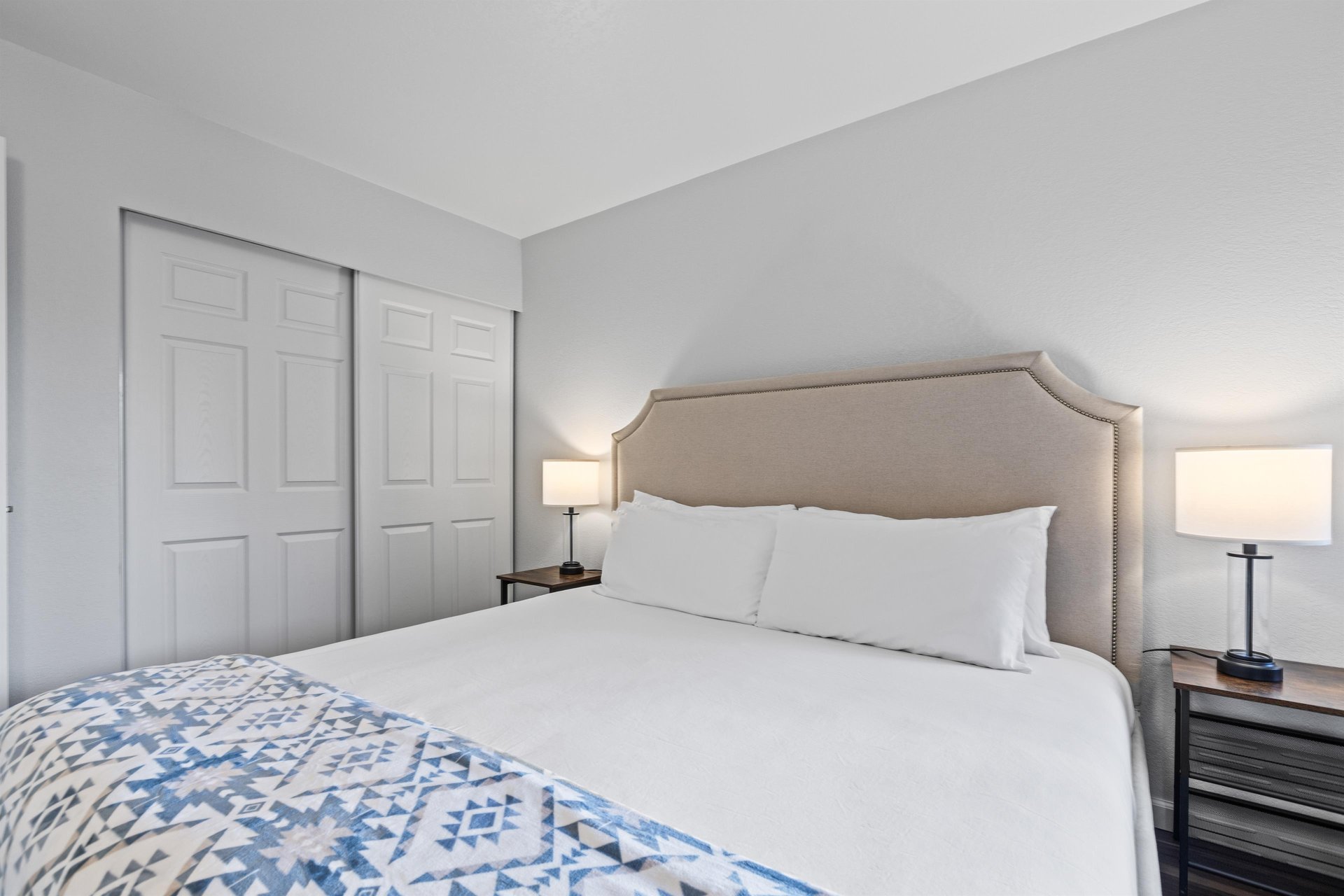 The bedroom offers a large closet and kingsize bed.