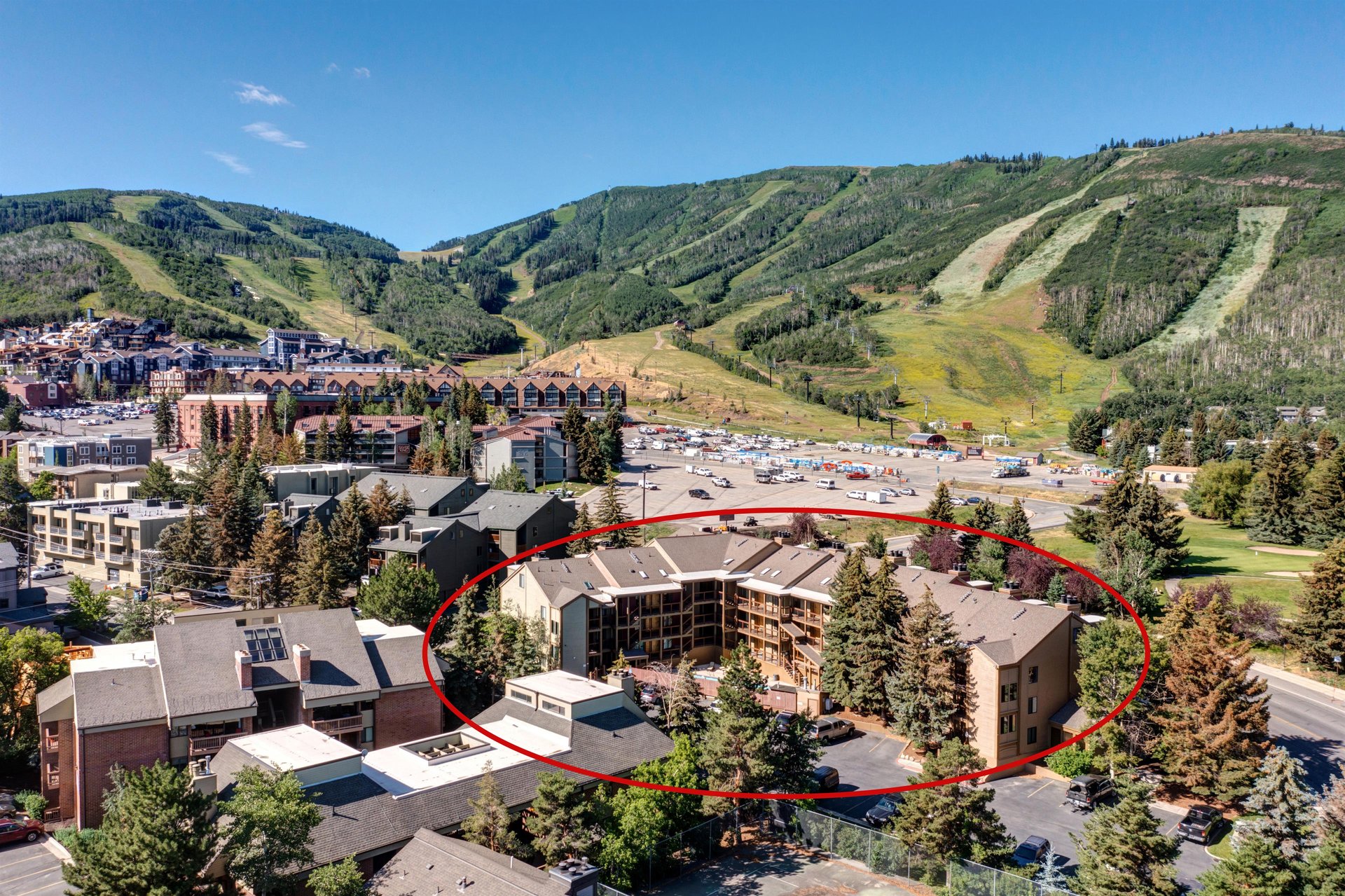 Snowcrest Condominiums with Park City Mountain Resort directly behind it in the summertime.