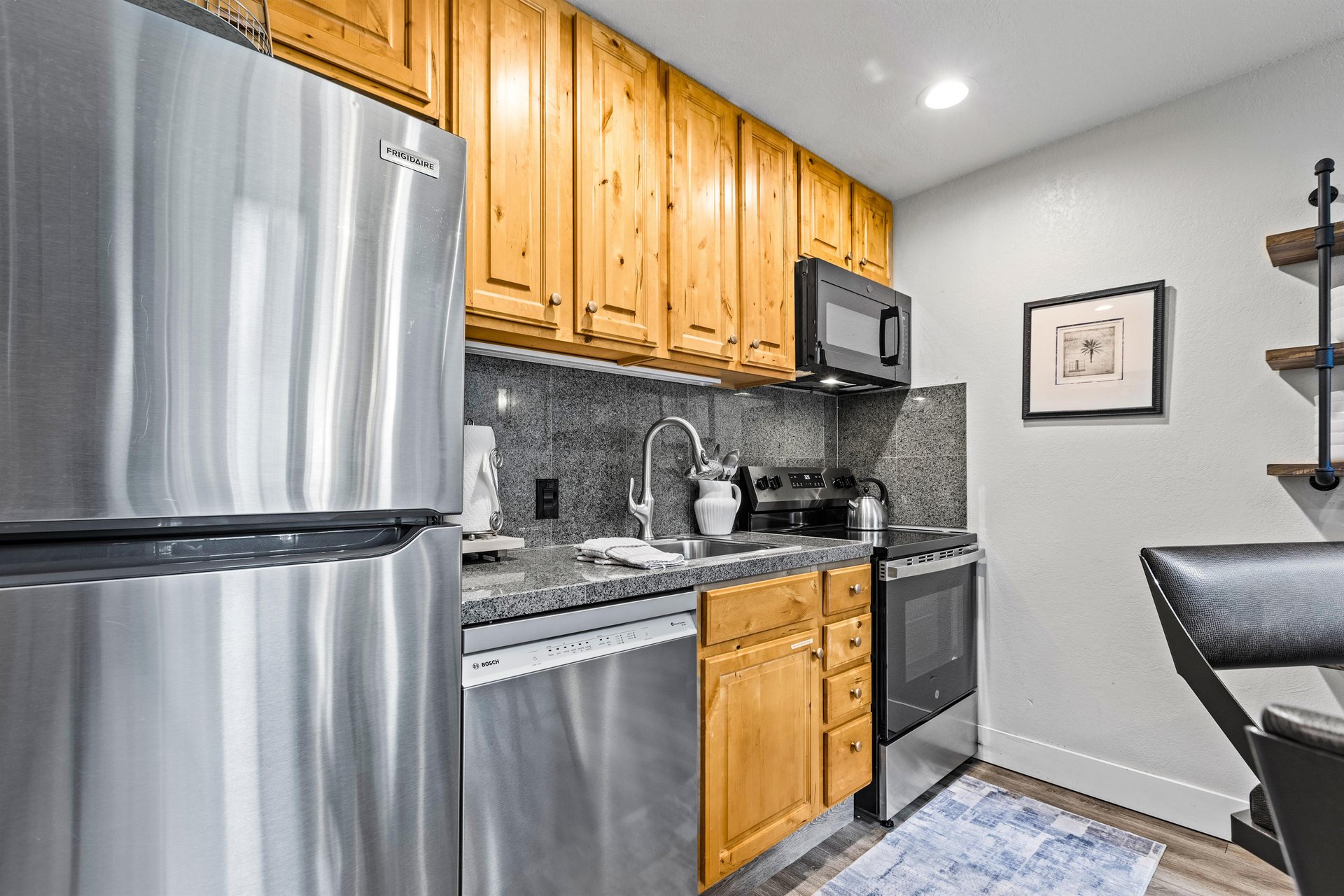 Snowcrest 302 has an open concept kitchen with stainless steel appliances.