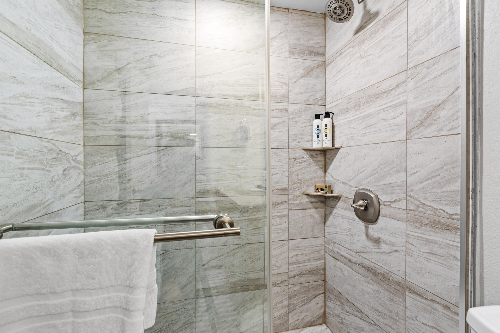 The bathroom with a bathtub and shower combination.