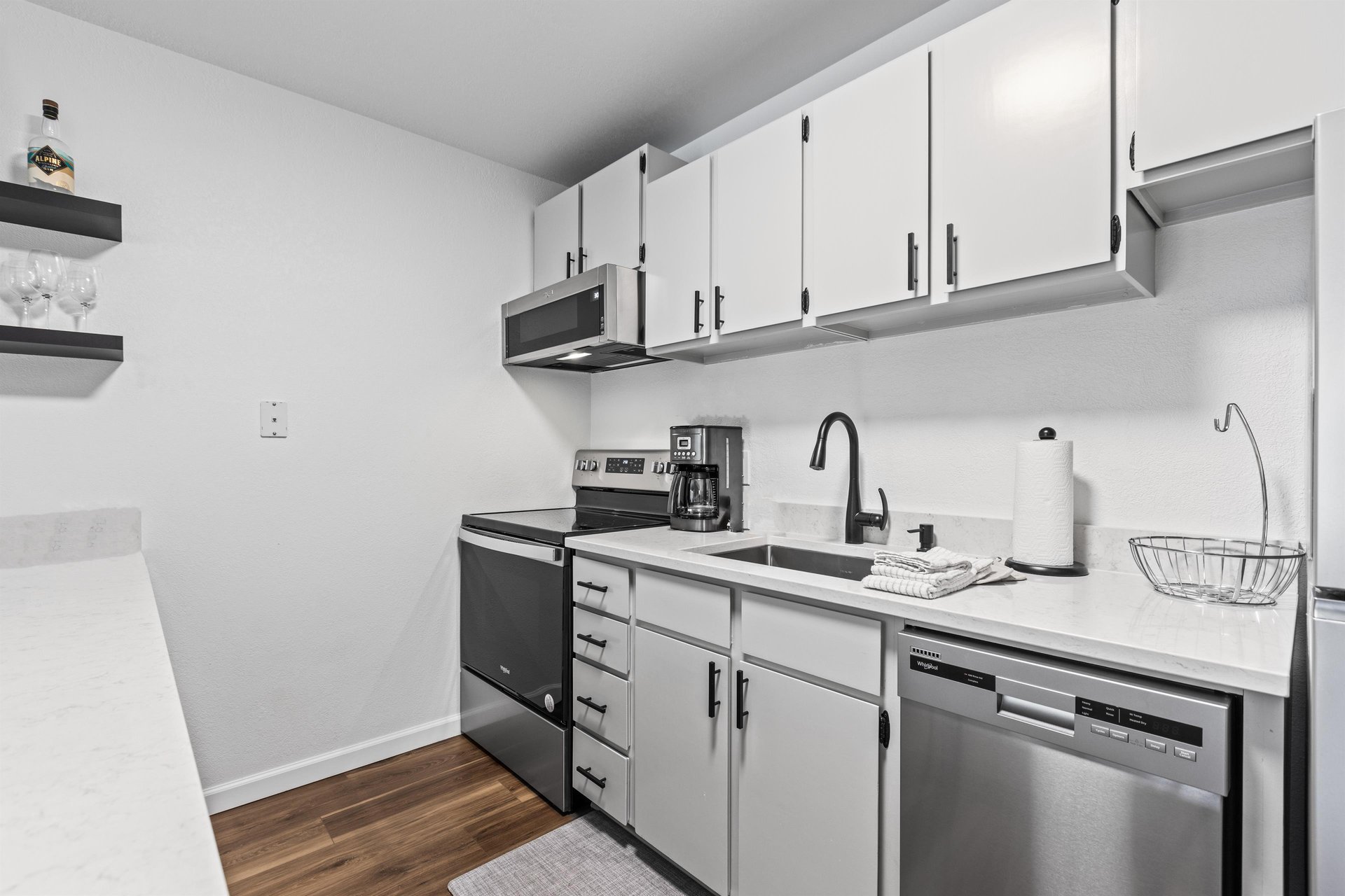 The well equipped kitchen with stainless steel appliances.